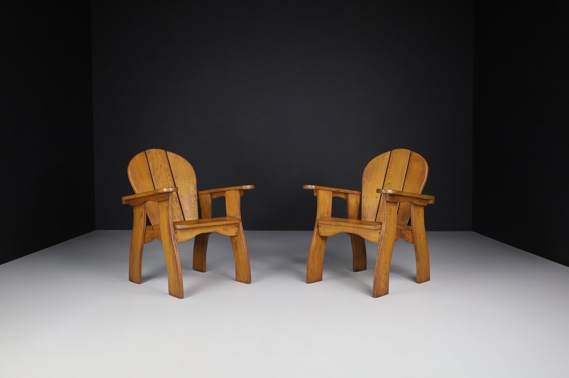 Exceptional Pair of French Brutalist Lounge Chairs in Sculpted Solid Oak, 1960s
Striking in both scale and craftsmanship, this exceptional pair of Brutalist lounge chairs was crafted in France during the 1960s, showcasing a powerful blend of