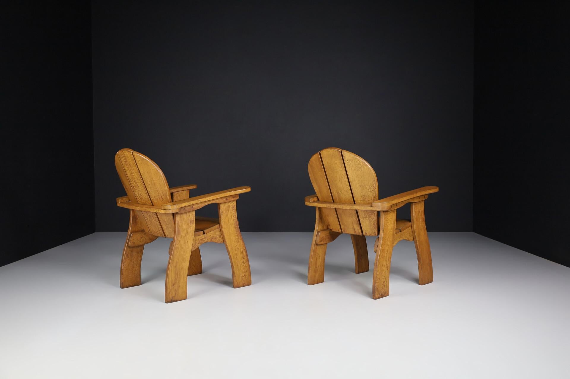 20th Century Exceptional Pair of French Brutalist Lounge Chairs in Sculpted Solid Oak, 1960s For Sale