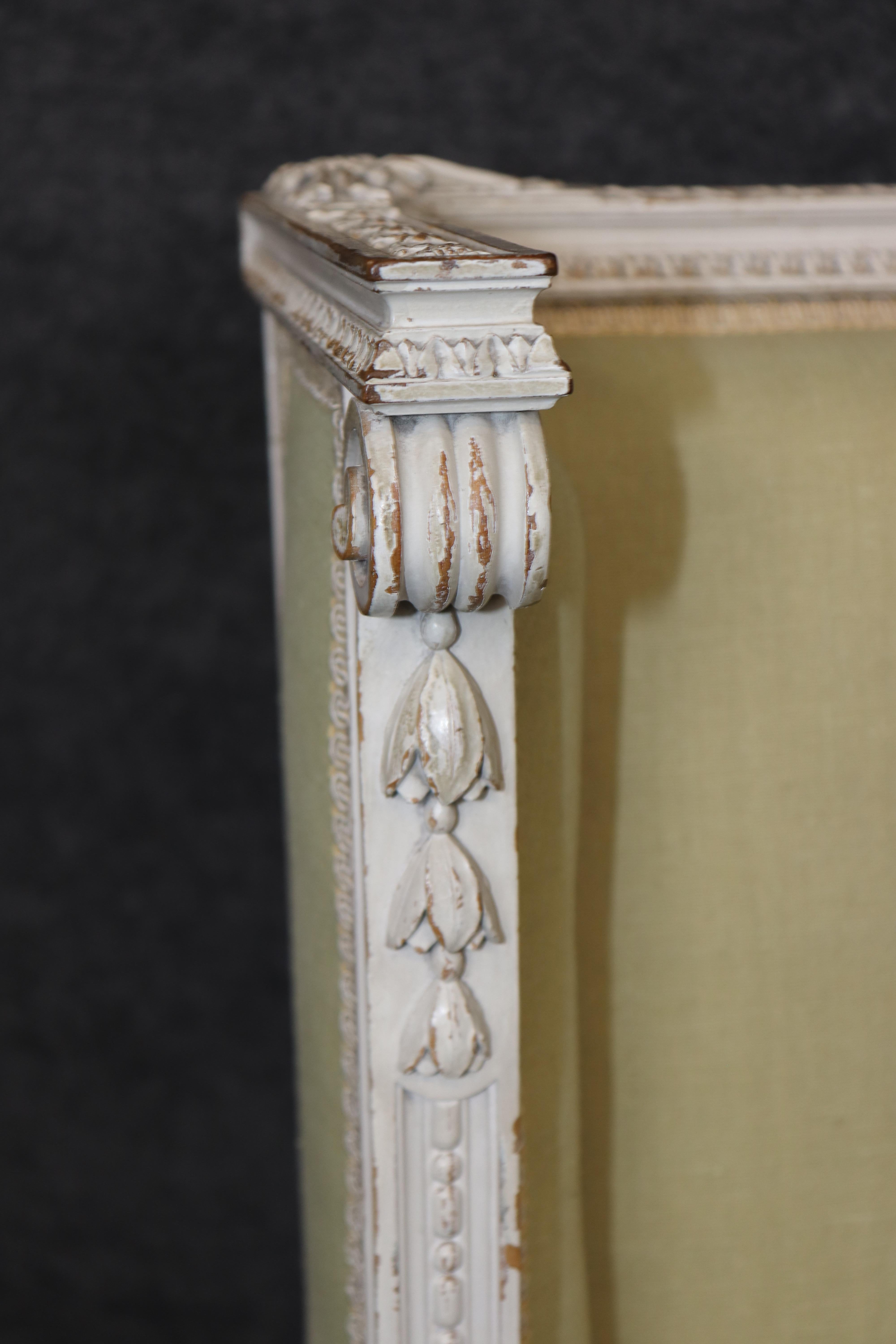Exceptional pair of French Louis XVI Style Creme Painted Bergere Chairs For Sale 6