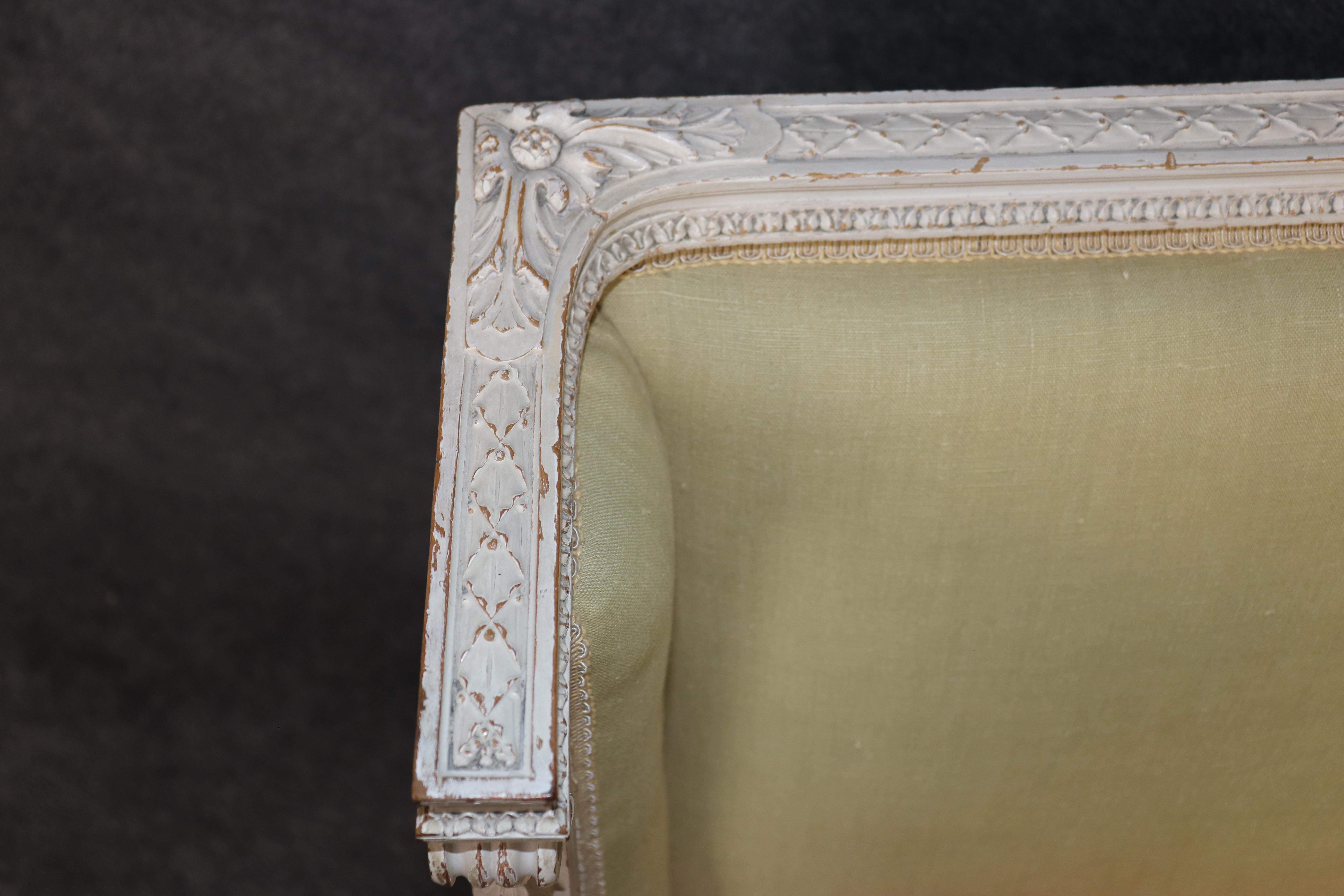 Exceptional pair of French Louis XVI Style Creme Painted Bergere Chairs For Sale 7