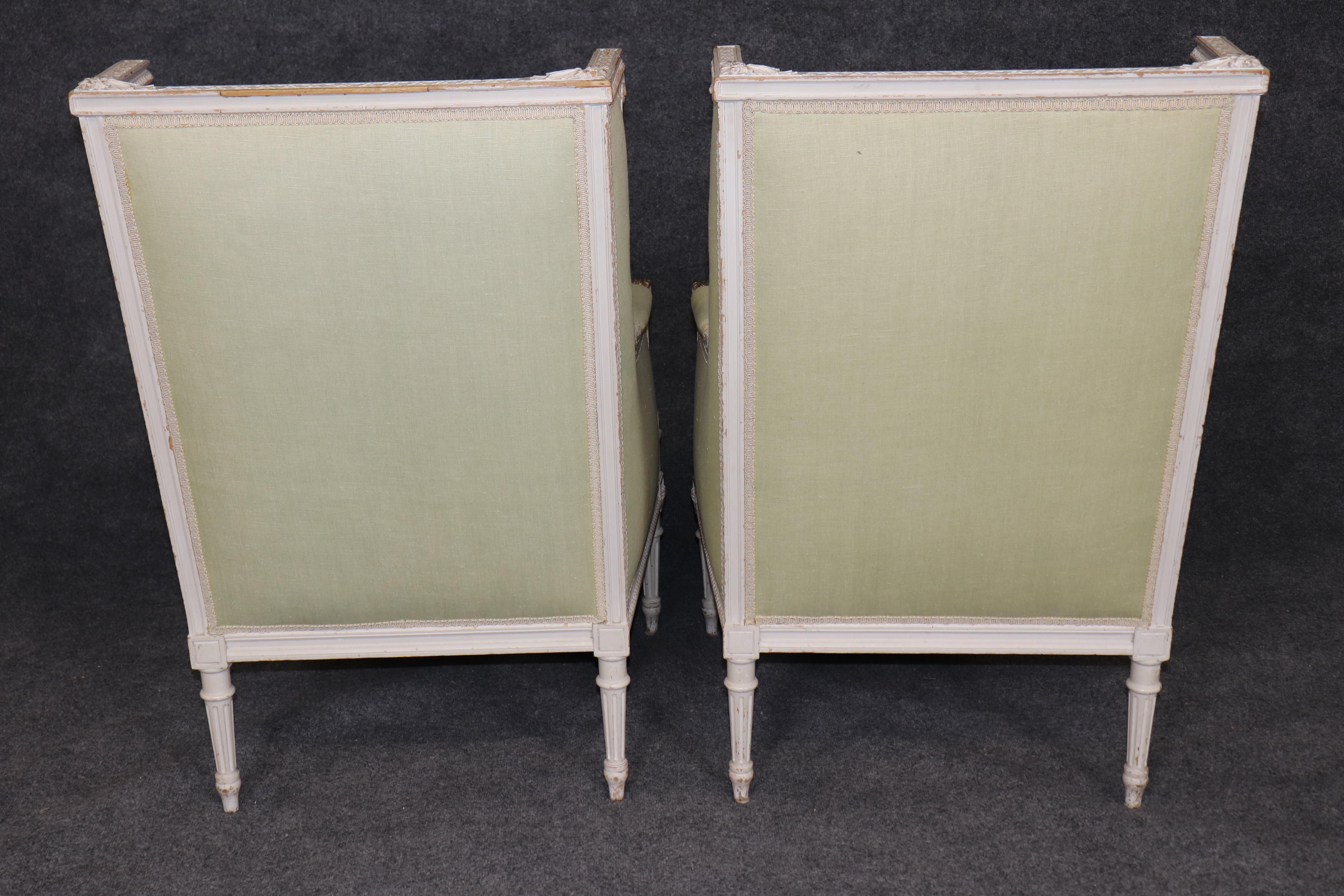 Early 20th Century Exceptional pair of French Louis XVI Style Creme Painted Bergere Chairs For Sale