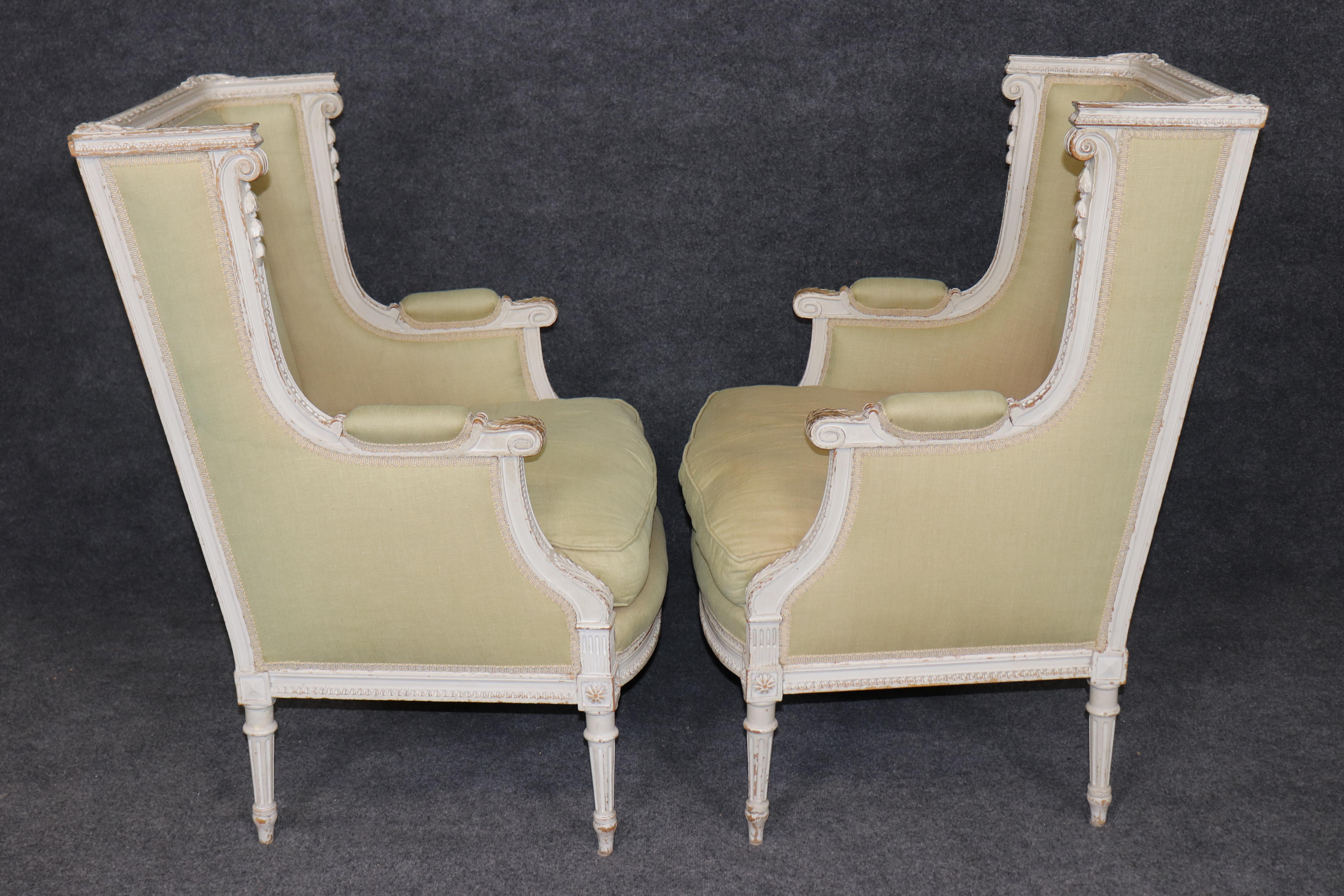 Walnut Exceptional pair of French Louis XVI Style Creme Painted Bergere Chairs For Sale