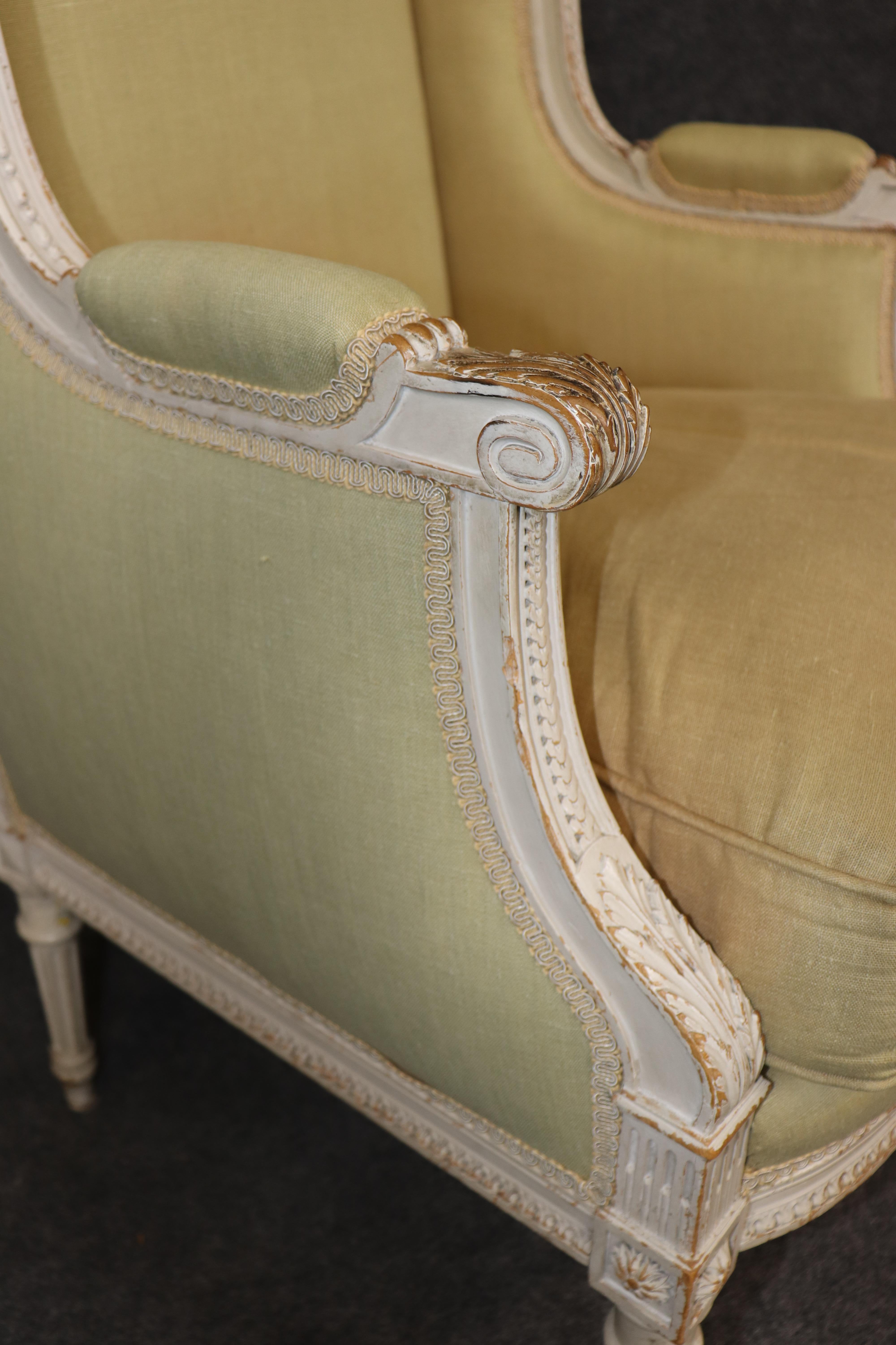 Exceptional pair of French Louis XVI Style Creme Painted Bergere Chairs For Sale 3