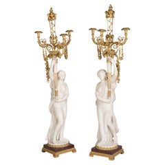 Eccezionale coppia di candelabri francesi in marmo con montatura in ormù di Sormani di Parigi