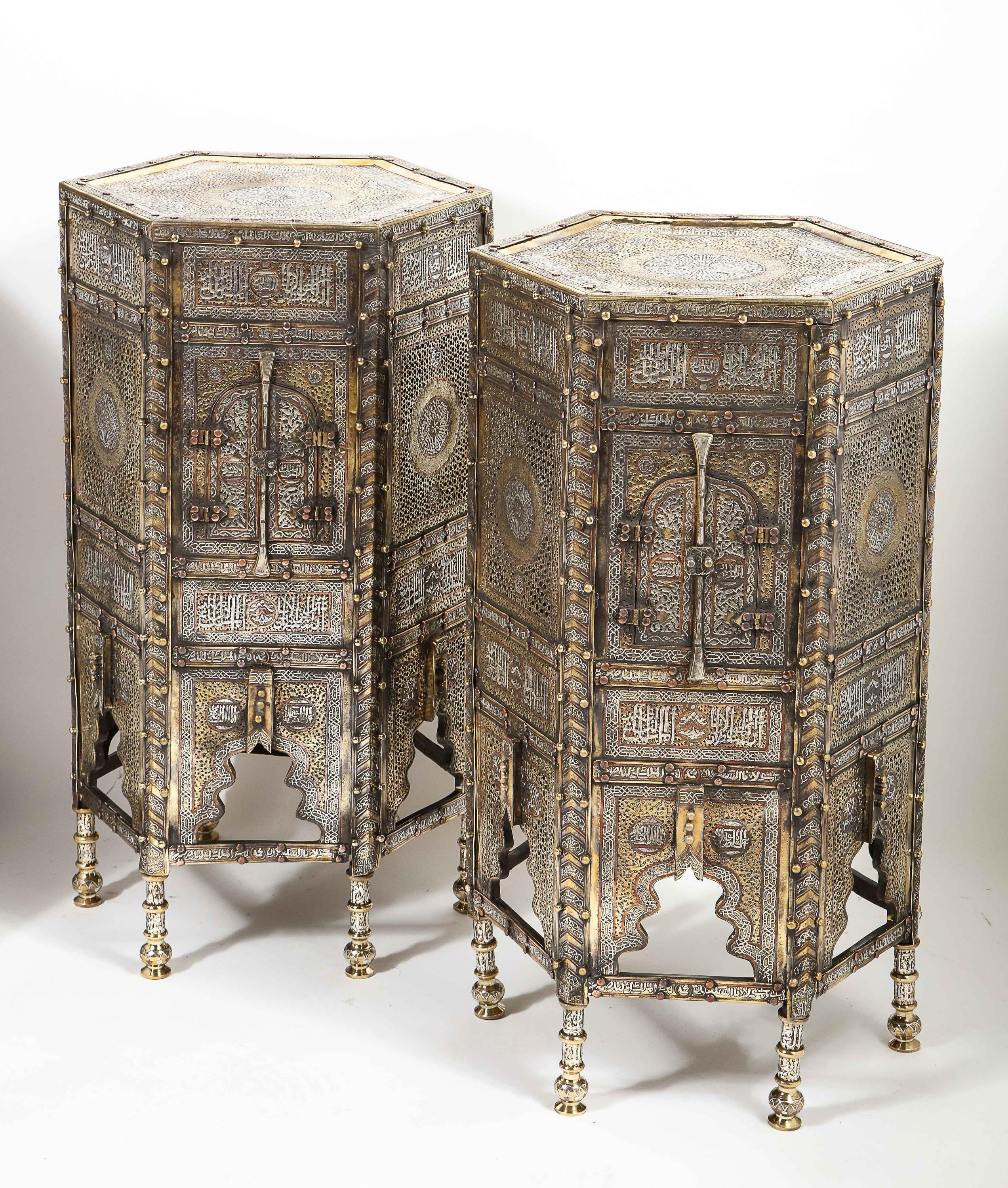 An exceptional and rare pair of Islamic Mamluk Revival silver and copper inlaid Quran Koran side tables, Egypt, circa late 19th century.

Fully silver inlaid cairoware tables. Very decorative with Arabic calligraphy throughout. Similar ones in
