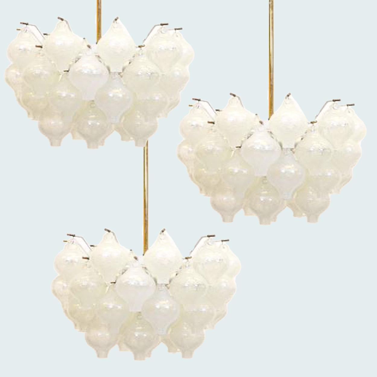 A set of 3 exceptional 'Tulipan' chandeliers by J.T. Kalmar, Austria, Vienna, manufactured in 20th century, circa 1970, (late 1960s-early 1970s). With beautiful Murano Tulipan shaped blown bubble glasses. Several glasses are mounted on a white