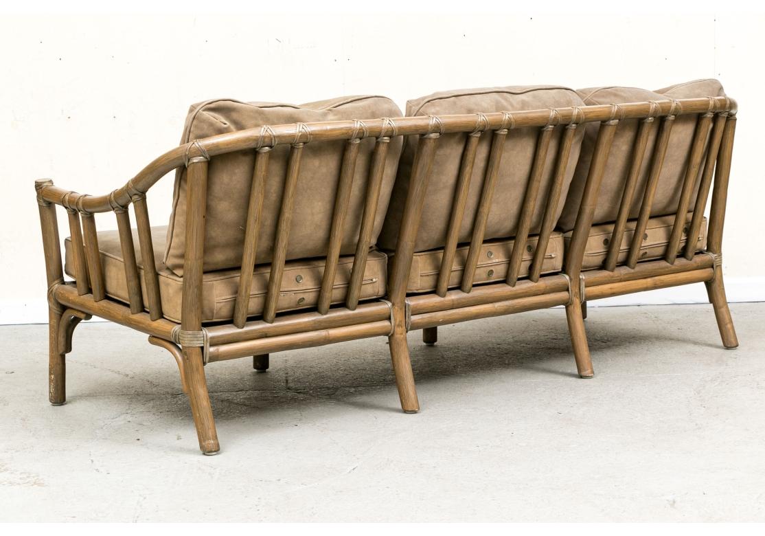 American Exceptional Pair Of McGuire Rattan Framed Sofas For Sale