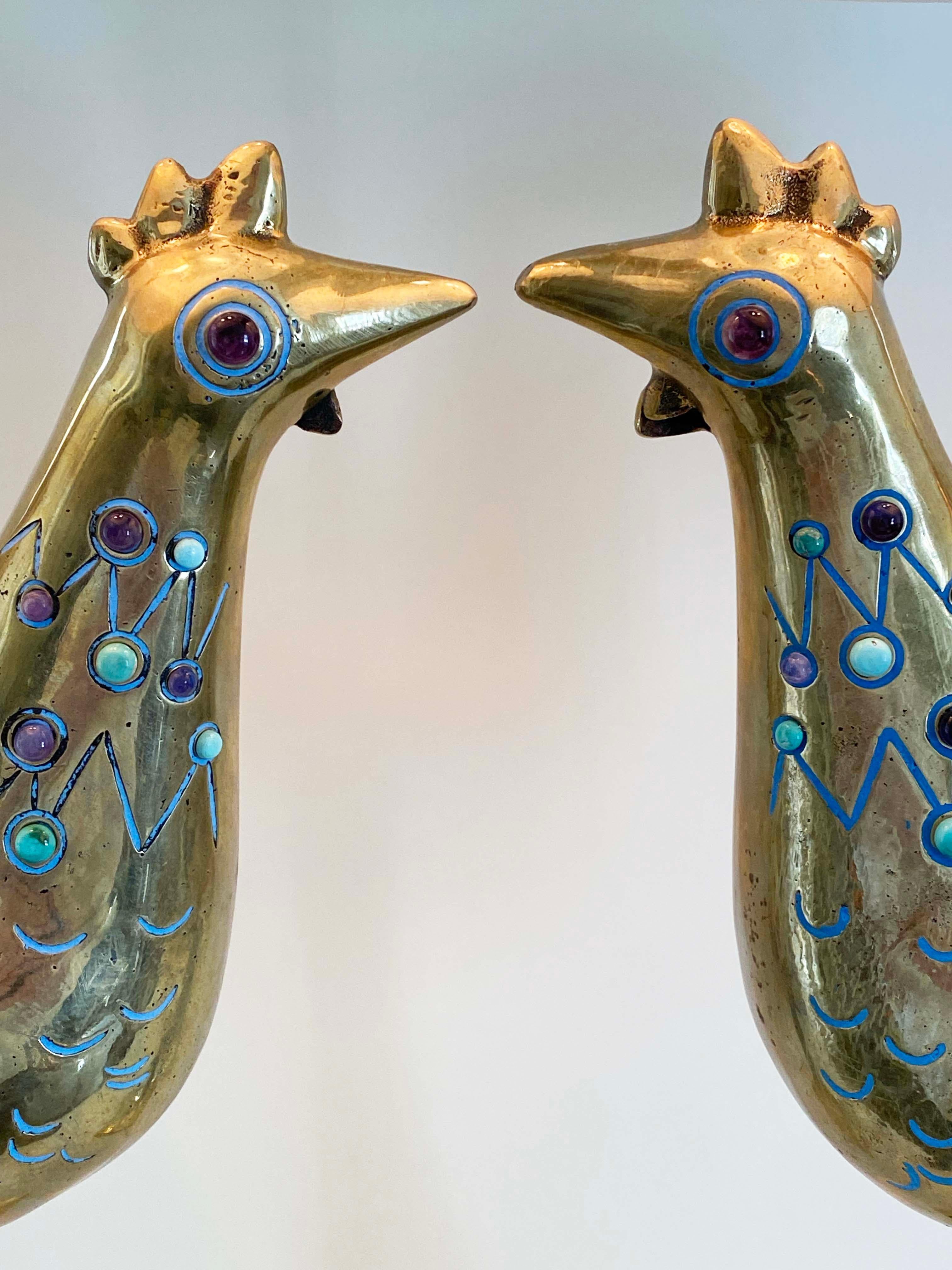 Here's a wonderful and rare pair of lamps from the 1960s by Mexican designer Pepe Mendoza. The lamps are large and HEAVY. Each lamp weights approximately 30 pounds. The lamps are solid brass with ceramic inlay. The debossed areas in the castings are