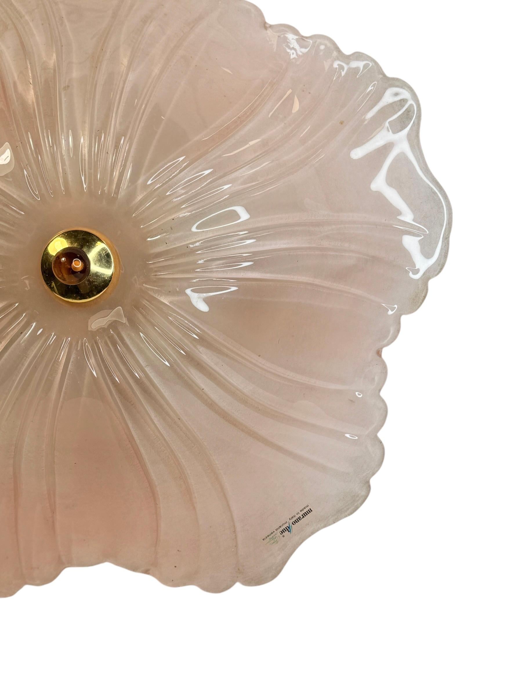 A beautiful glass flush mount. Made in Murano Venice Italy, made by Murano Due. Gorgeous textured glass flush mount with metal fixture. The Fixture requires five European E14 / 110 Volt Candelabra bulbs, each bulb up to 40 watts. A nice addition to