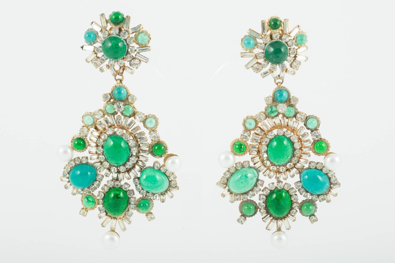 These exquisite poured glass earrings are true statement earrings, truly glamorous and quite unique. Handmade in way made famous by and instantly recognisable as Maison Gripoix, emerald coloured poured glass  and clear pastes are set in a gilded