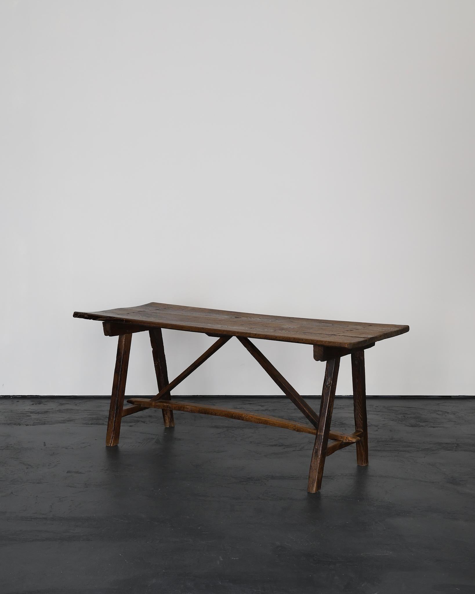 An exceptional 18th C. small scale “X” frame dining table from the Trás-os-Montes region of north east Portugal.

Constructed in a combination of elm & chestnut with many are old repairs.

Heavily patinated due to hundreds of years of use.

An