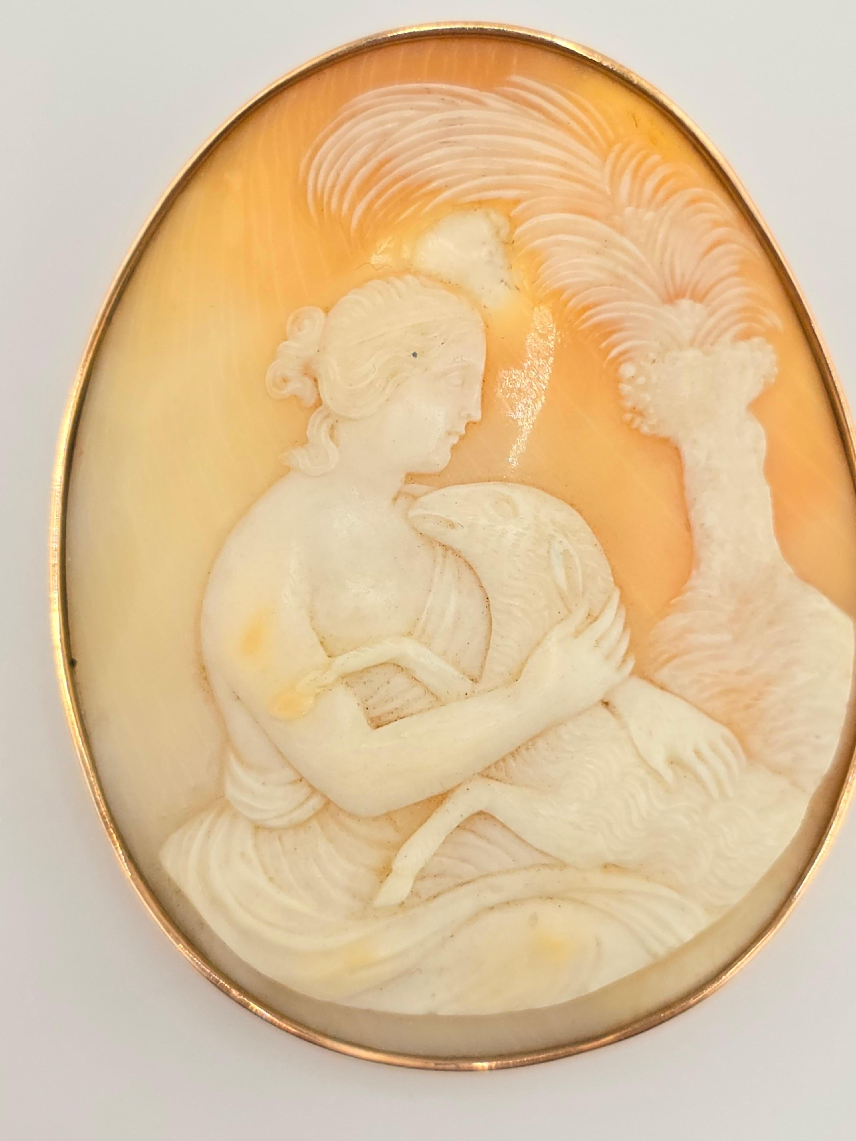 This is a very unique antique 14K gold cameo brooch, it has a lovely scenery of a young lady and a sheep or lamb. The carving on the cameo is superb, and definitely finer than the usual ones you see. The hands, the face everything is fantastically
