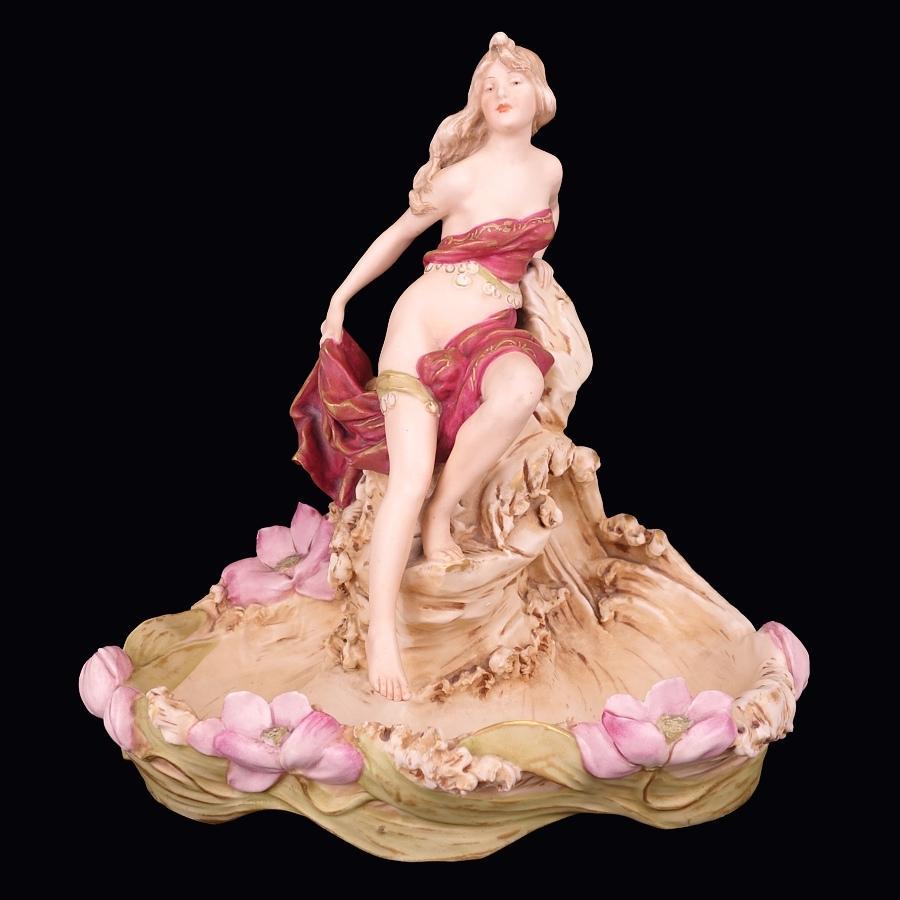 Offering this super high quality, signed Royal Dux (Bohemia) porcelain spill vase or vide-poche featuring a full-bodied gypsy maiden figure with aquatic and floral motif in an Art Nouveau design. Vase is hand painted and signed on the underside