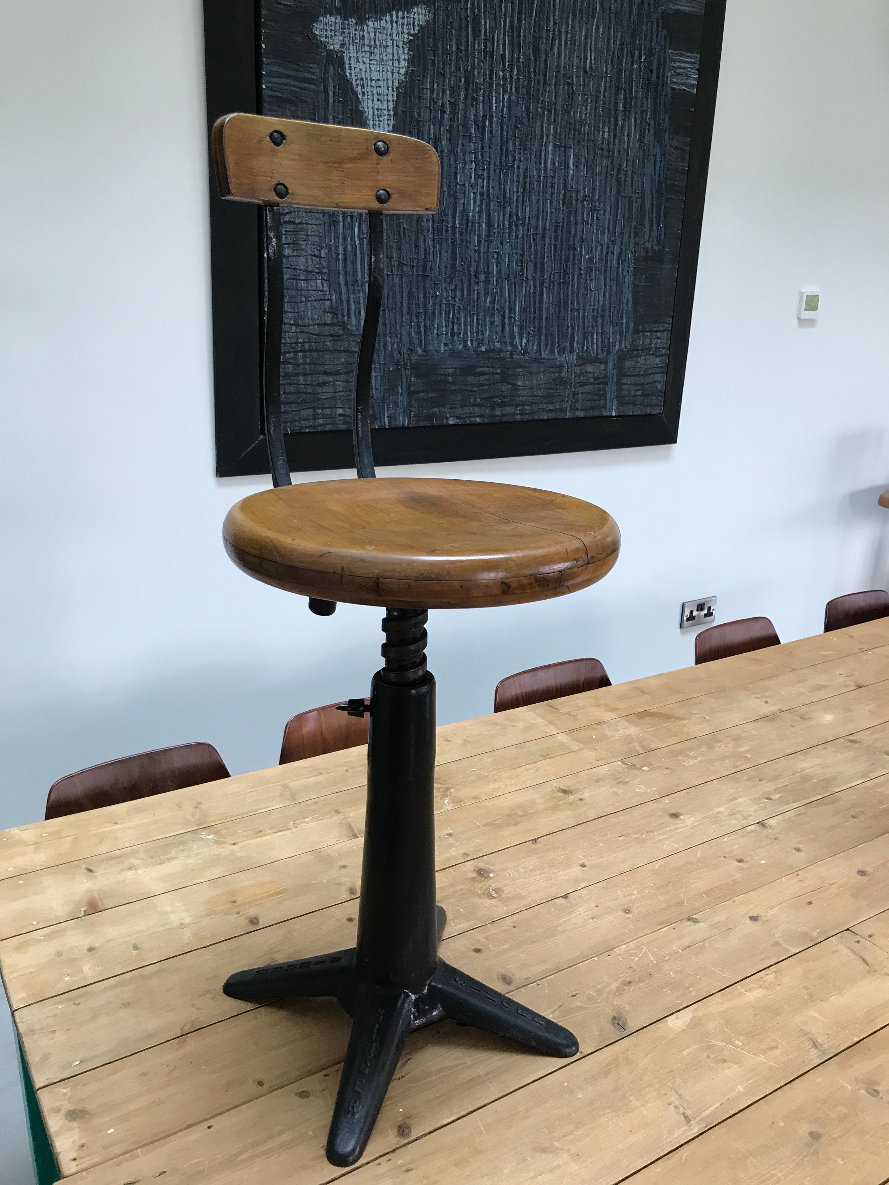 Exceptional quality cast iron singer industrial stool with backrest original condition

Fully height adjustable, seat between 45 and 64cm (18-25.5 inch) the backrest is sprung by two springs

Measurements are seat height between 45-64cm,