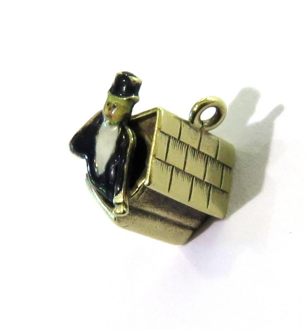 This art deco 14k enamel Man in the Dog House