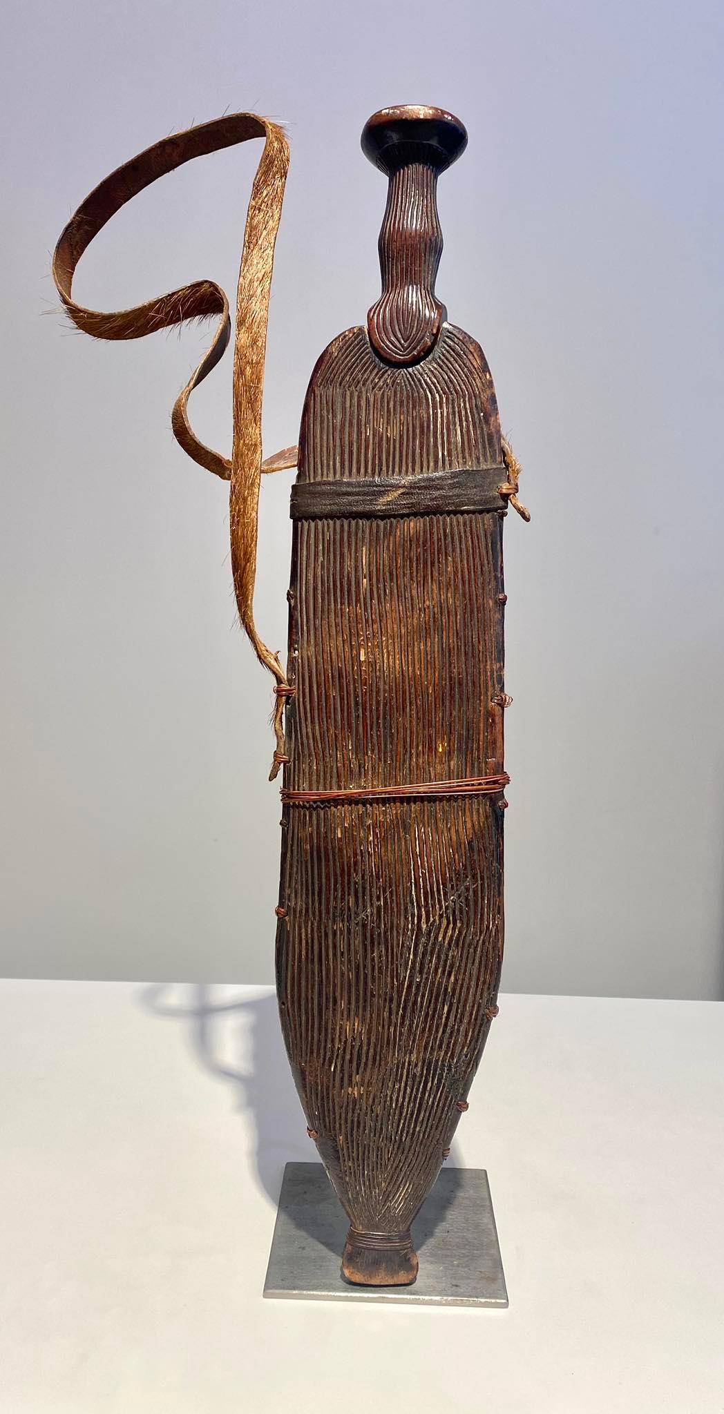 Exceptional Rare Knife/Sword From The Luba / Luluwa /Nkutshu Tribe DR Congo - circa 1900 
Tribe: Luba / Luluwa / Nkutshu
A unique museum piece
DR Congo
Period: 19th Century - ca 1900
Length: 56 cm with sheath (54 knife without sheath )
Perfect