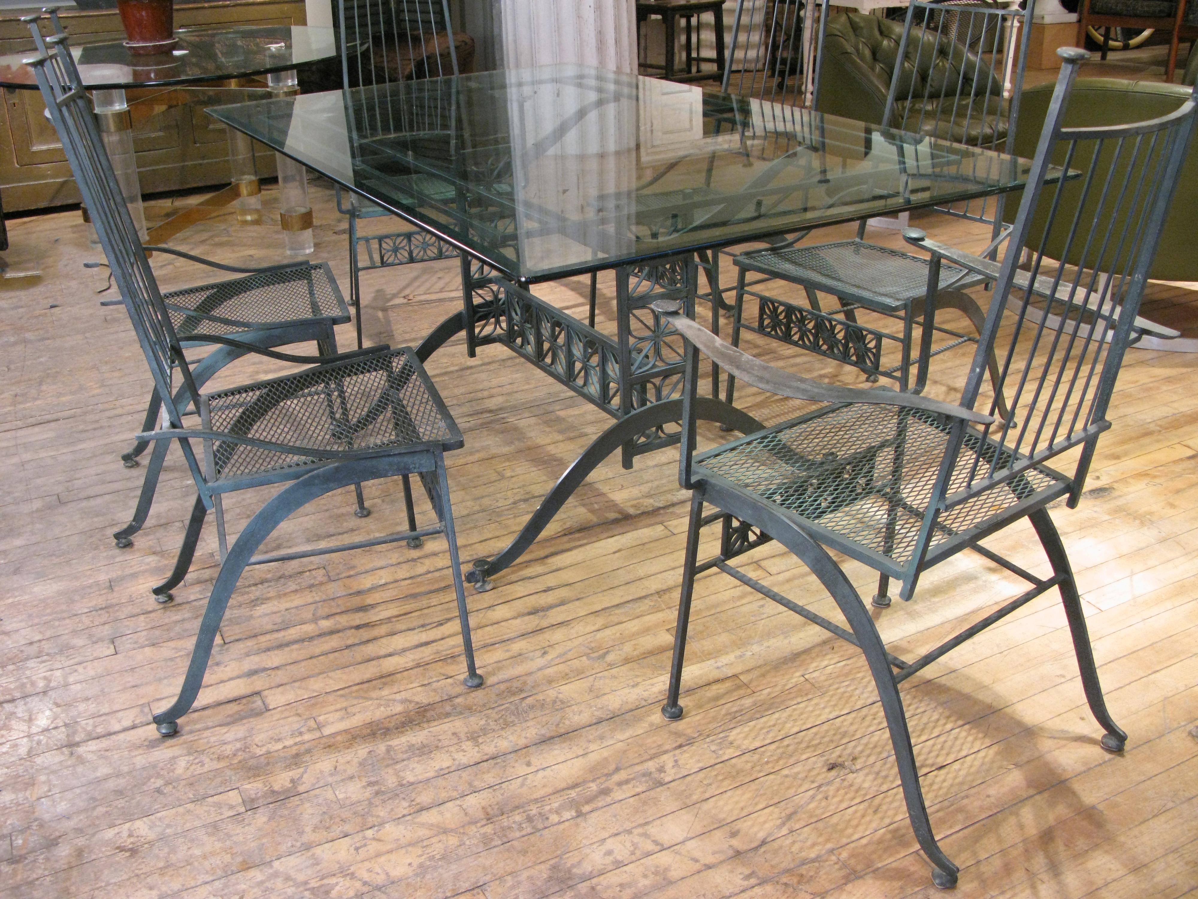 A very rare El Prado dining table and set of six chairs by Salterini, circa 1950s. This is one of their most beautiful series, with very low production. the wrought iron frames with curved legs, flat orb finials and feet, and the El Prado stylized