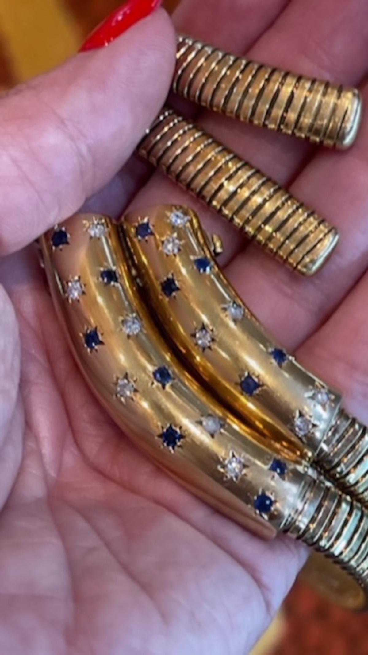 A highly coveted and extremely rare vintage Double Tubogas necklace set with diamonds and sapphires in a star setting along two double solid gold bars. 
The tubogas chains are attached and the closures are invisible within the diamond and sapphire
