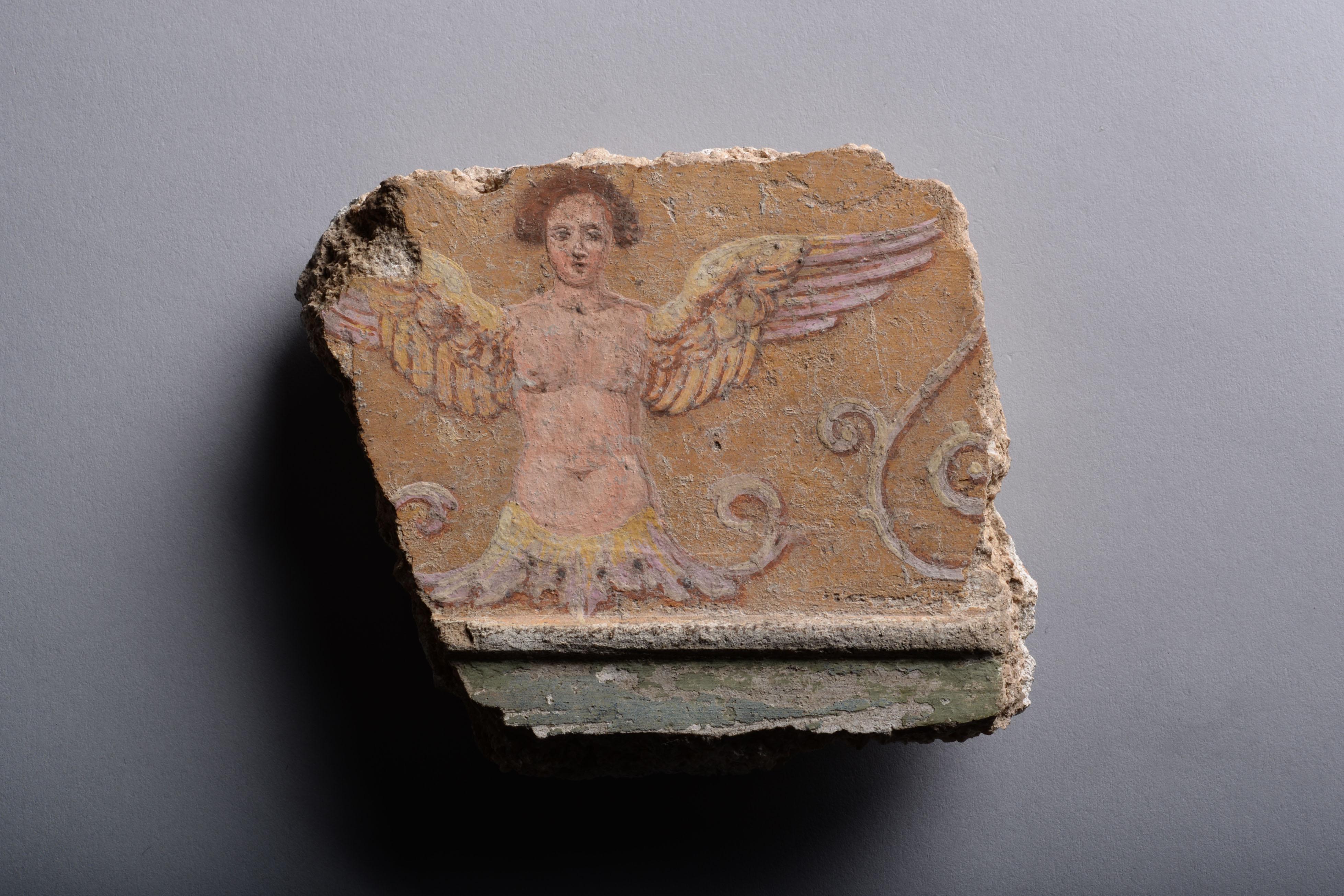 Roman Fresco Fragment Depicting a Siren
Circa 1st Century A.D.

‘‘Ludius … was the first to introduce the fashion of covering the walls of our houses with most pleasing landscapes, representing villas, porticos, ornamental gardening, woods,
