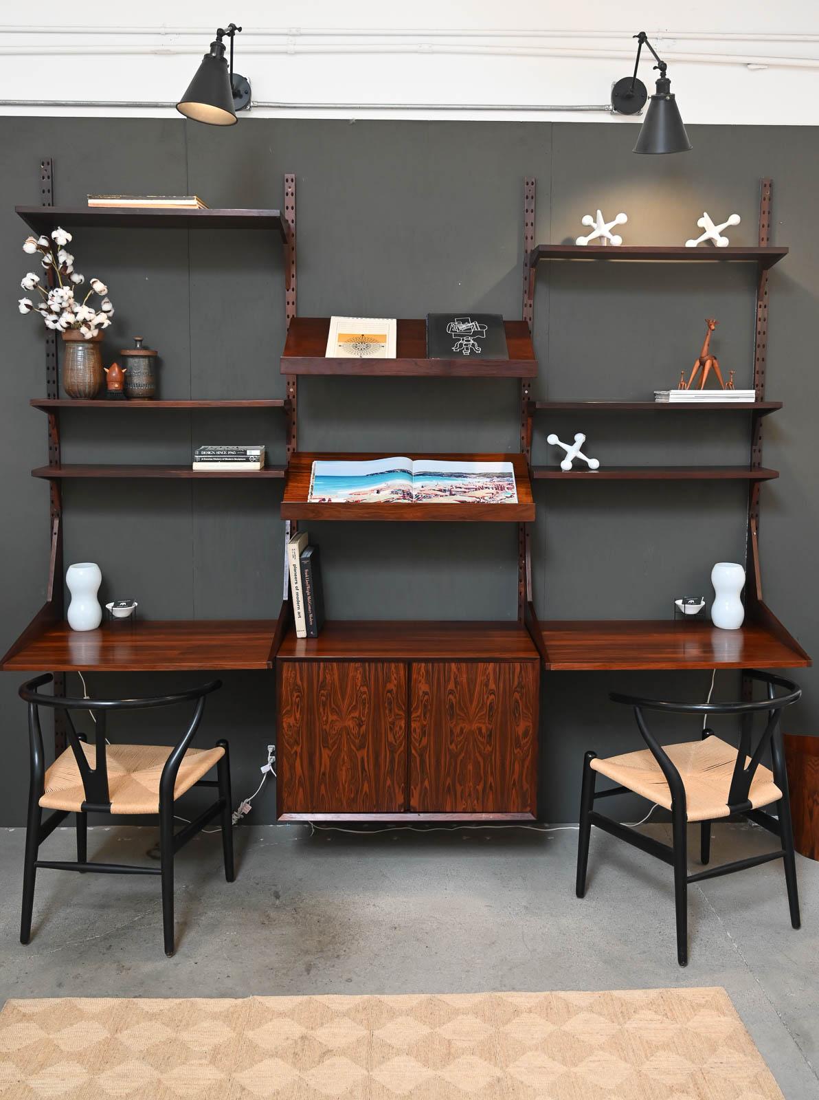 Exceptional Rosewood Wall Unit by Poul Cadovius, ca. 1965.  Incredibly stunning rosewood wall mounted shelving unit by Poul Cadovius, Denmark.  This is one of the finest and most beautiful pieces we have curated and included all shelving shown as