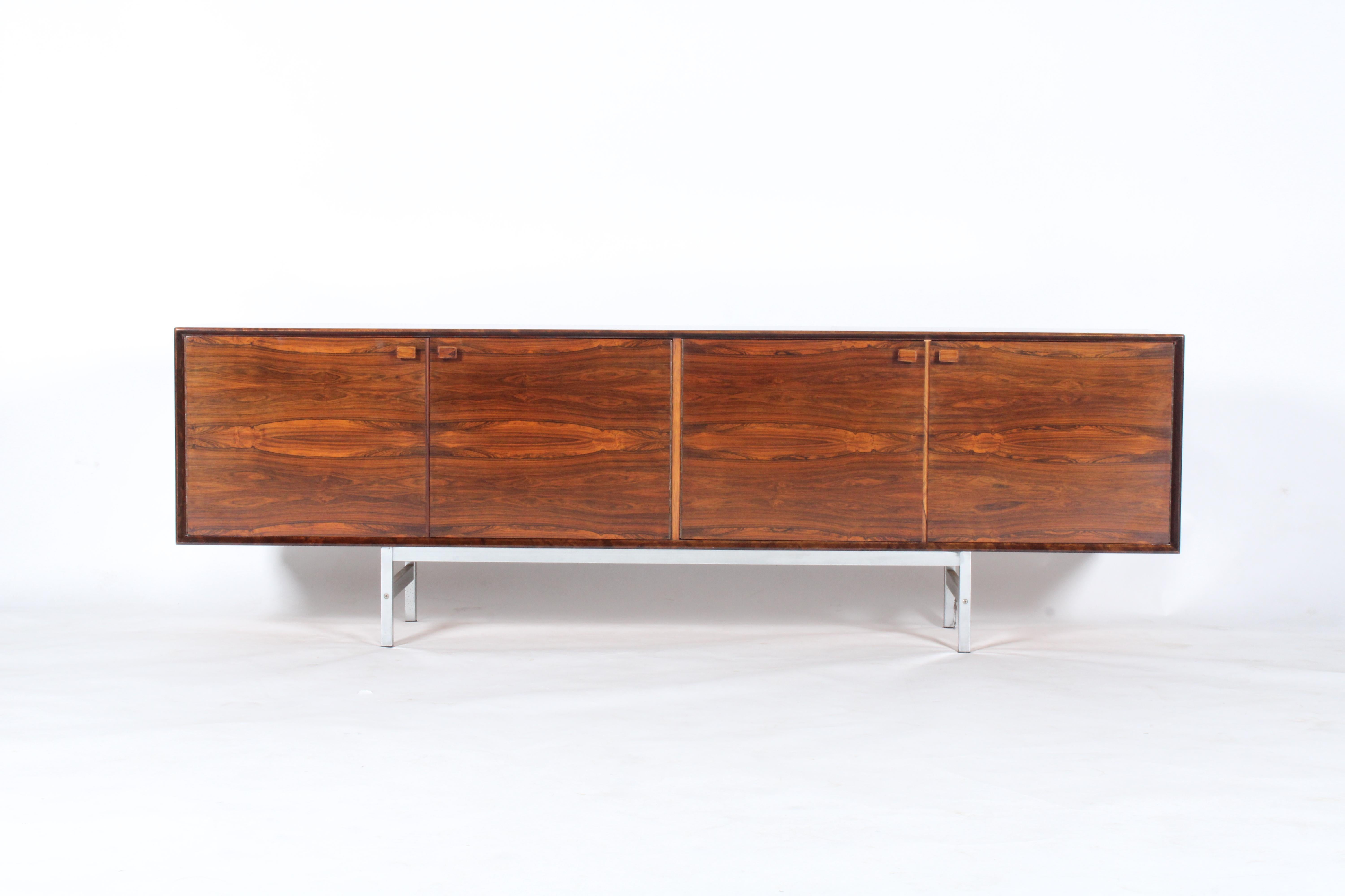 What can only be described as a Scandinavian masterpiece, sideboards simply don’t come any better. The beauty of this piece lies in its simplicity of design with beautiful clean lines and truly amazing rosewood grain pattern. Set upon a stainless