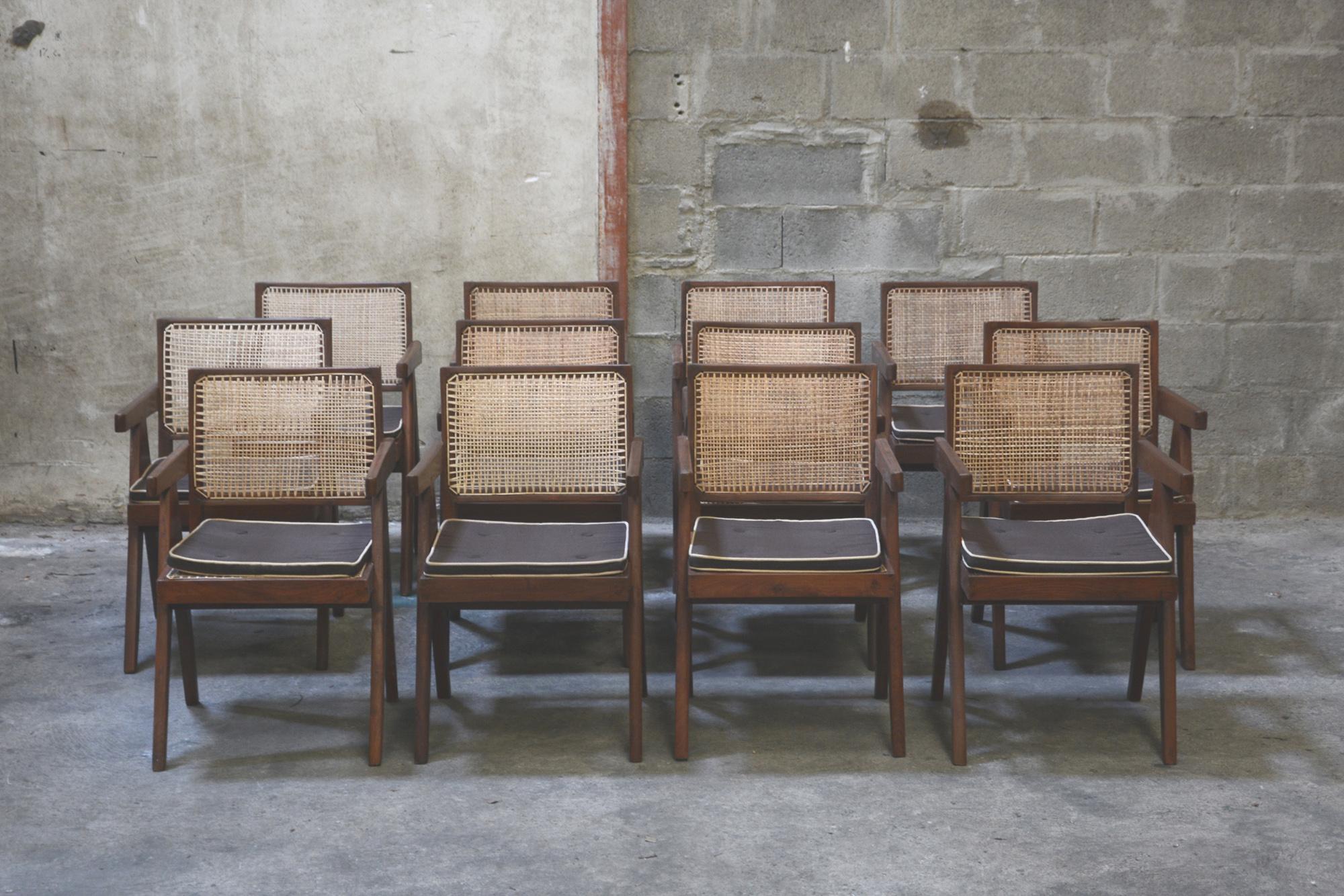 Pierre Jeanneret, Exceptional rare set of 12 cane and teakwood office Armchairs designed for an administrative building in Chandigarh, India. Back attached to the seat. Teak, woven cane and upholstered seat cushion featuring cloth covering. 4 are