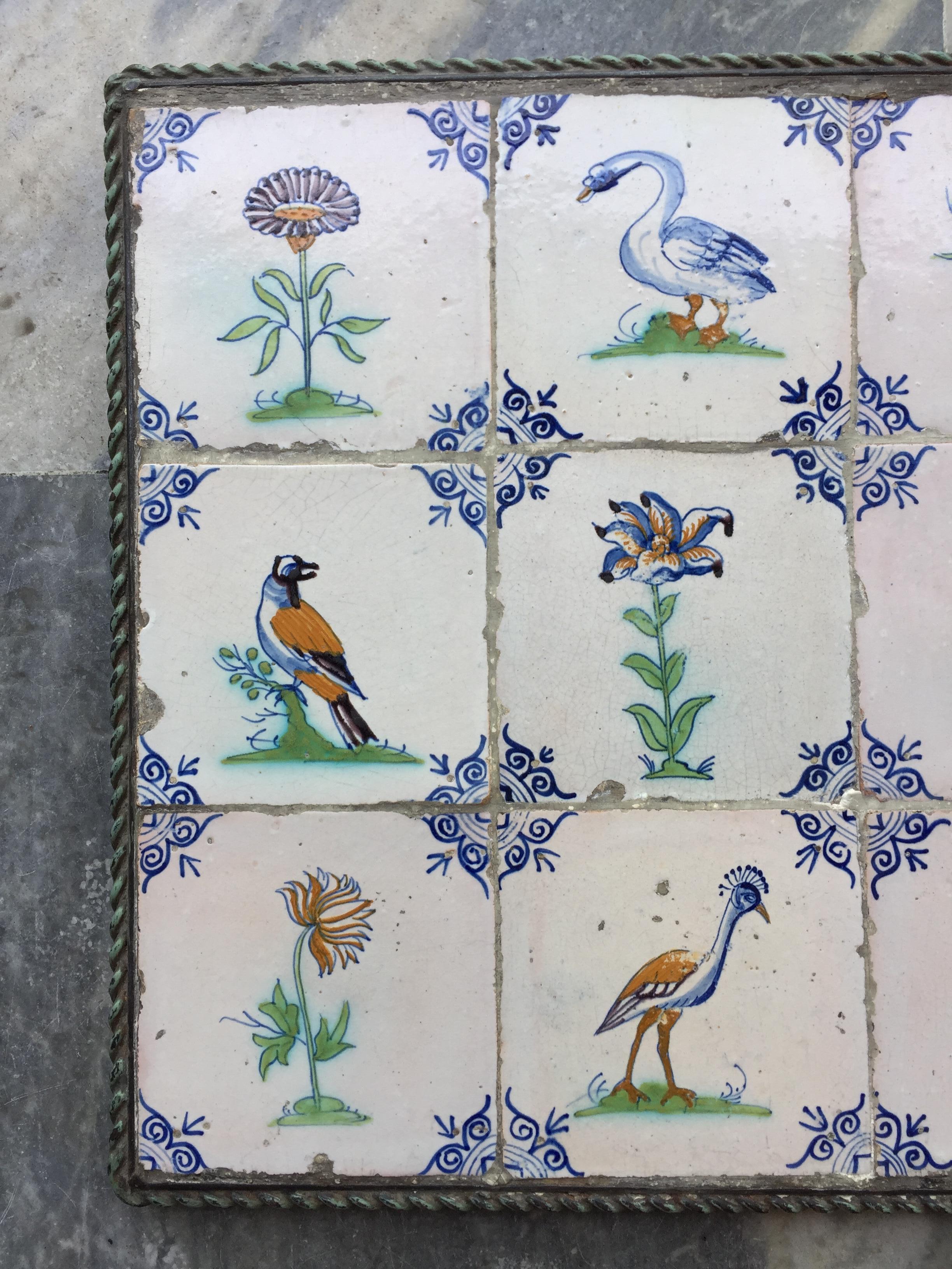 An exceptional set of 15 polychrome Dutch Delft tiles with birds, flowers, and insects. 
Made in The Netherlands, circa 1625 - 1650.

This set of tiles is of very fine quality and has a wonderful bright glaze. The images are painted after engravings