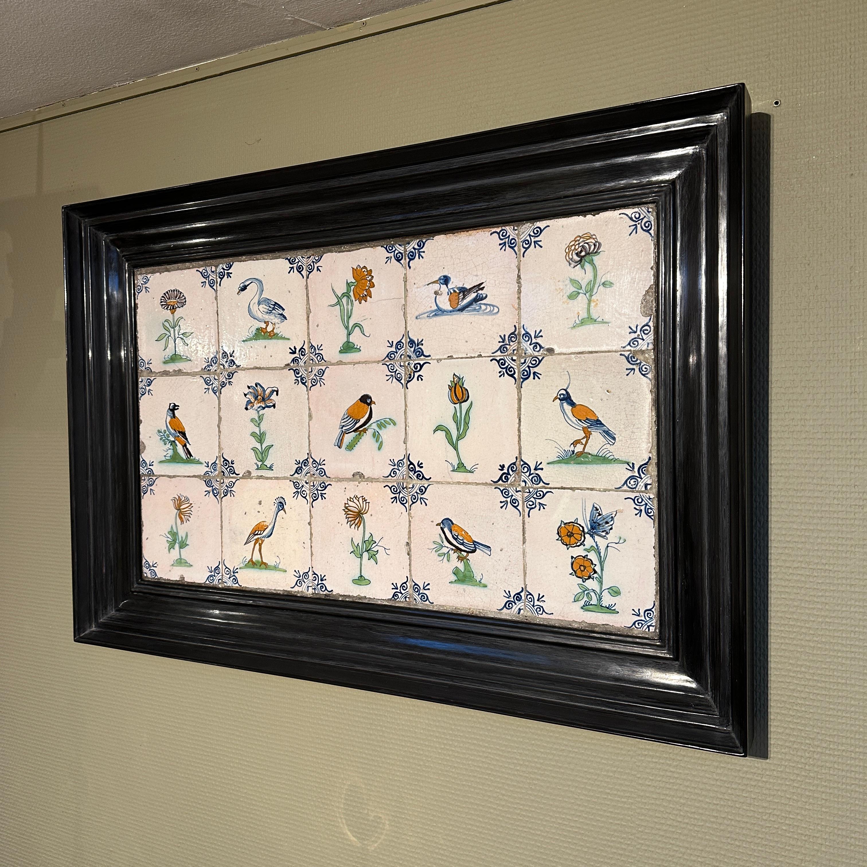 An exceptional set of 15 polychrome Dutch Delft tiles with birds, flowers, and insects. 
Made in The Netherlands, circa 1625 - 1650.

This set of tiles is of very fine quality and has a wonderful bright glaze. The images are painted after engravings