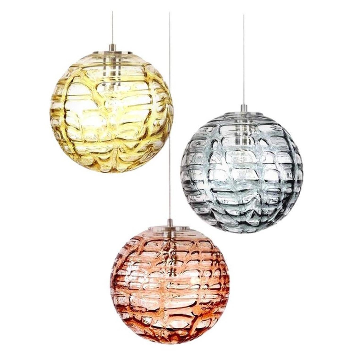Set of 3 Doria pendant lights (in collaboration with Murano) in the style of Venini, manufactured, circa 1960. Real statement pieces. High-end thick Murano crystal glass shade made out of overlay glasses of different colors (pink, amber, grey)