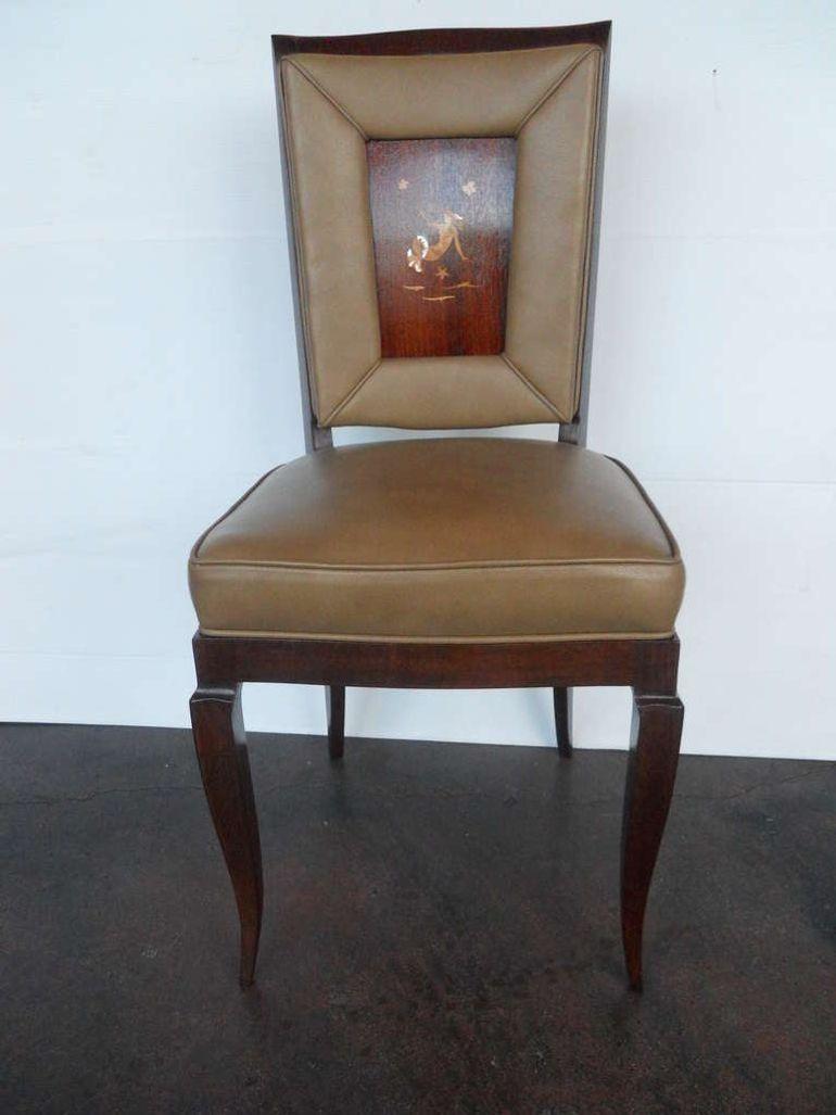 Exceptional set of 6 chairs in the style of Gil Ponti, consisting of Mother of pearl and maple inlay on rosewood. Newly refinished and upholstered in leather.
Dimensions (each):
39