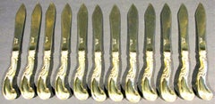 An Exceptional Set of Twelve Art Nouveau Silver Gilt Fish Knives, circa 1900