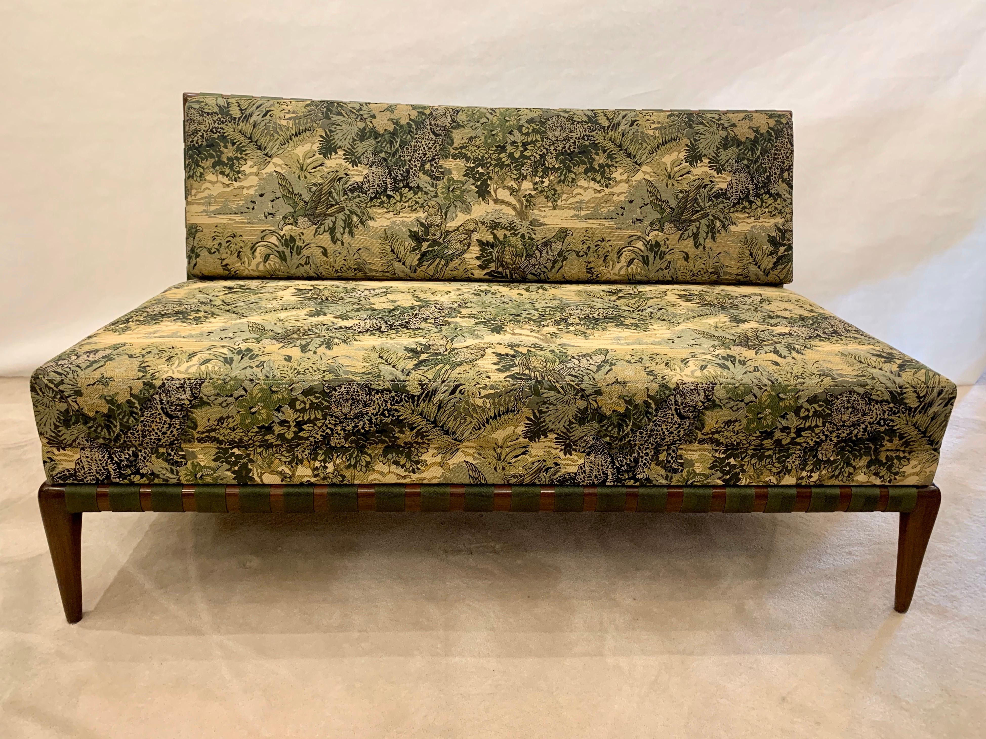 Solid walnut frame in an espresso finish and dark green woven strapping base and backing. The newly upholstered cushions are in a fabulous animal/ jungle print which is fun and subtle. This is a truly exceptional piece. Ready to place in your home!