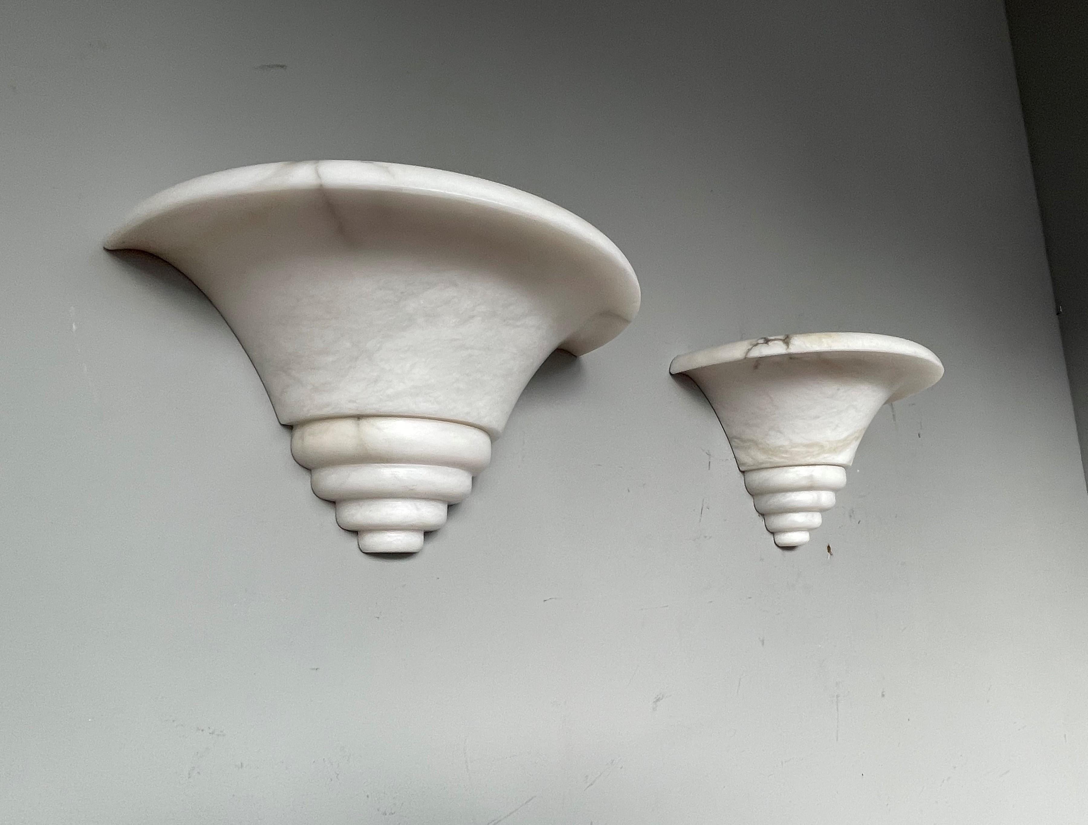 Stunning, geometrically-circular and near mint Art Deco style wall sconces.

If you are looking for a stylish and timeless way to bring light into your entry hall, bathroom, kitchen or bedroom or if you are looking for the perfect wall lights over
