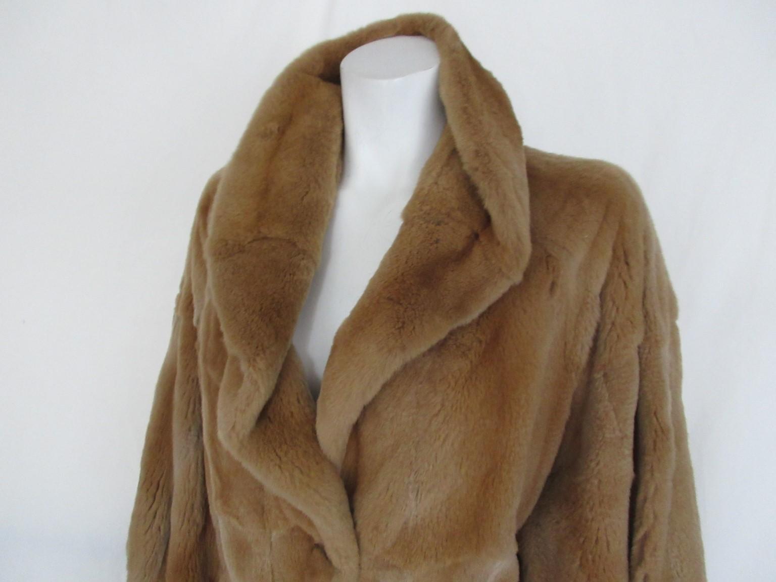 This gold tone brown coat is made of super soft quality sheared mink fur.
Made by Bonnie Models, designed by Manfred Bogner a German fur specialist from 1980's

We offer more luxury fur items, view our front store

Details:
Very soft and light