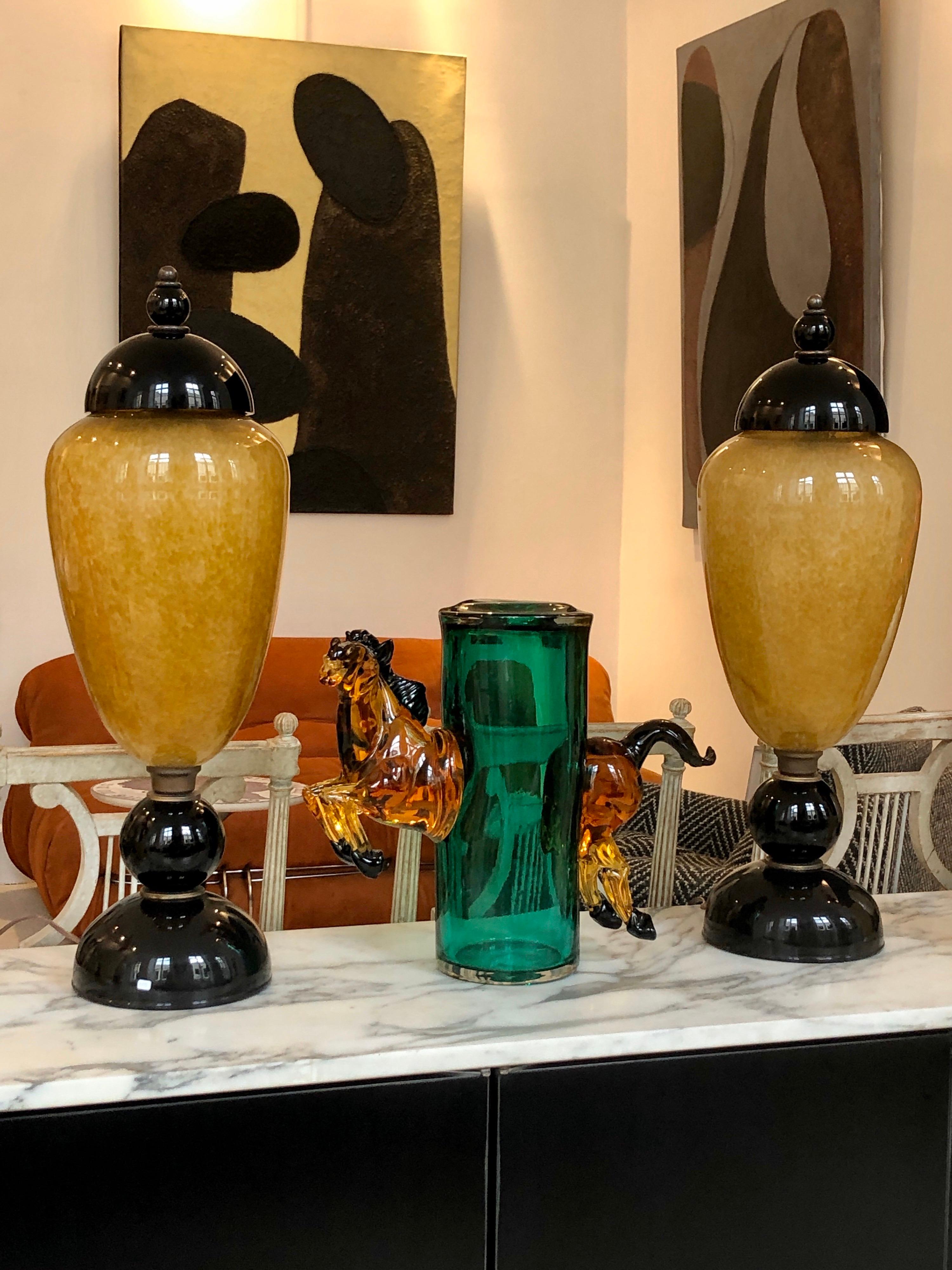 This green emerald and amber Murano glass vase jumping Horse is more than a vase, a is a splendid sculpture! For a horse lovers this master piece on a top of a consol in your entry will be an eye catcher 
As you see in the picture number 8 the leg