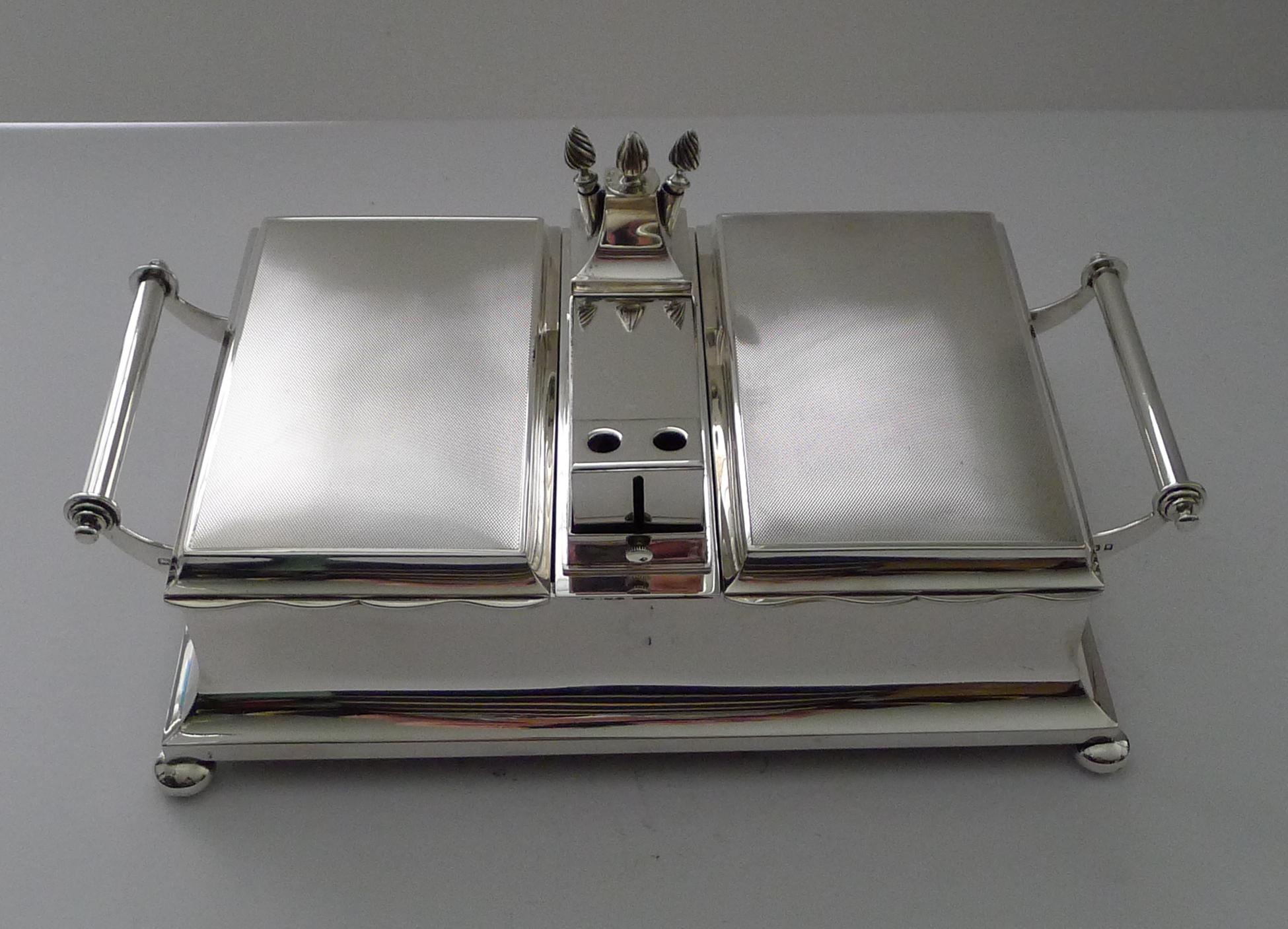 A truly exceptional Art Deco Gentleman's smoking compendium, beautiful quality by the highly sought-after silversmith, Mappin & Webb.

This impressive piece stands on four original bun feet and incorporates two hinged lidded cedar-lined cigar