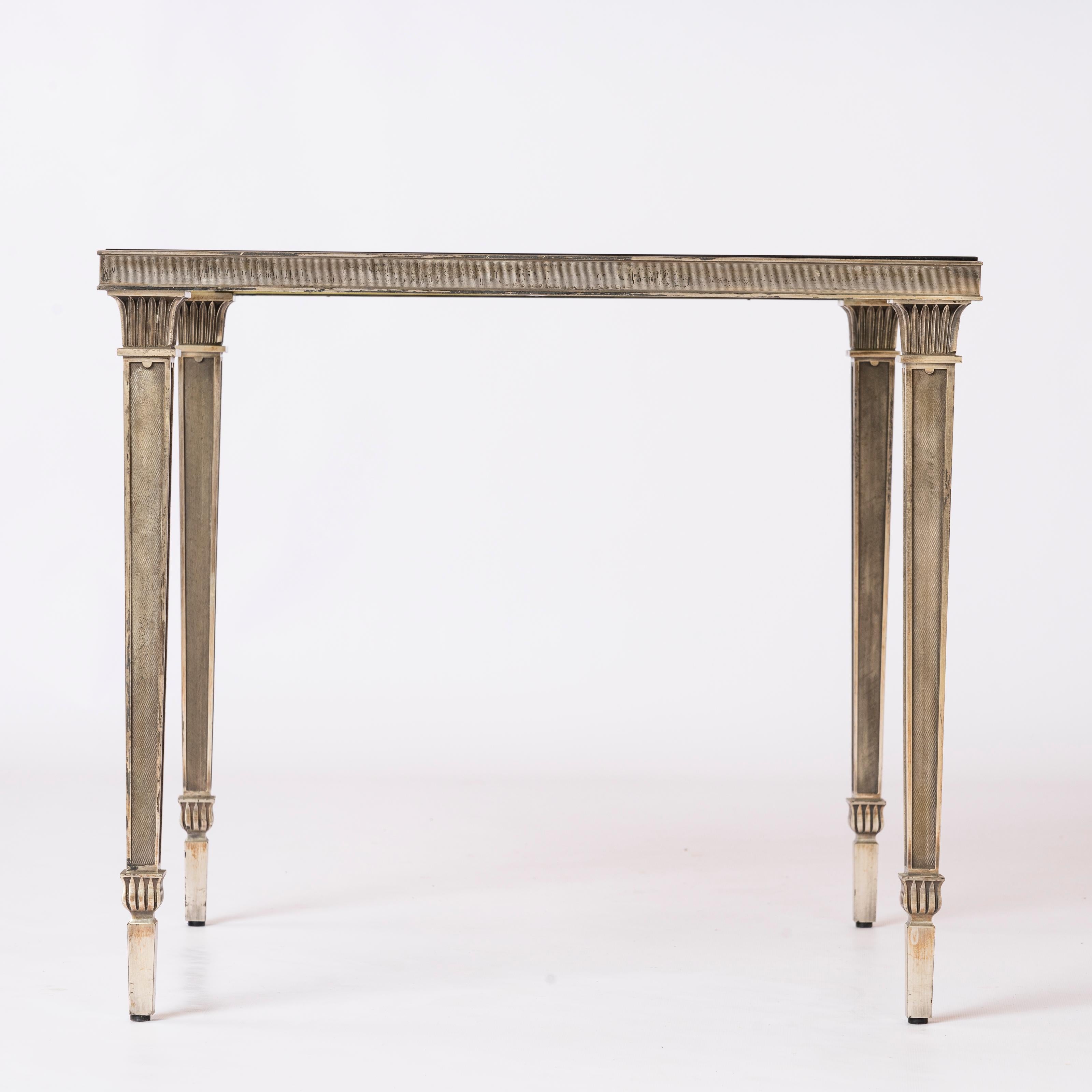 France 1970's
rarest silver plated occasional table with slightly blue mirror edges original glass top
good vintage condition
original patina
minor surface scratches on glass
this table will ship from Paris and can be returned to either Paris
