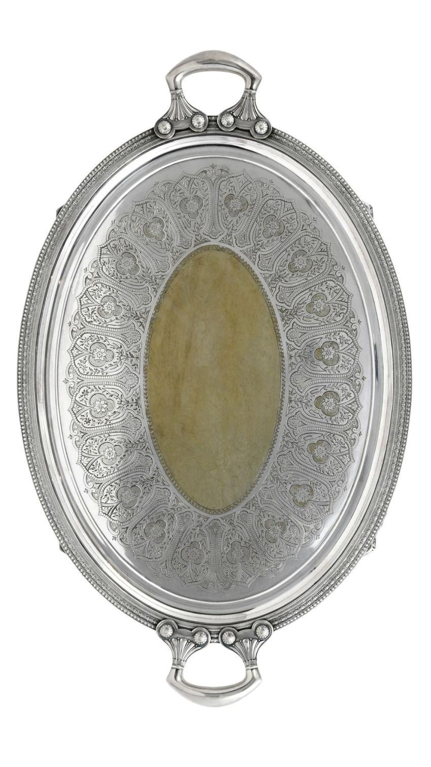 Large, antique19 century  silver plate salver with gilt wash by Tiffany and Company with finely embossed designs and handles.
