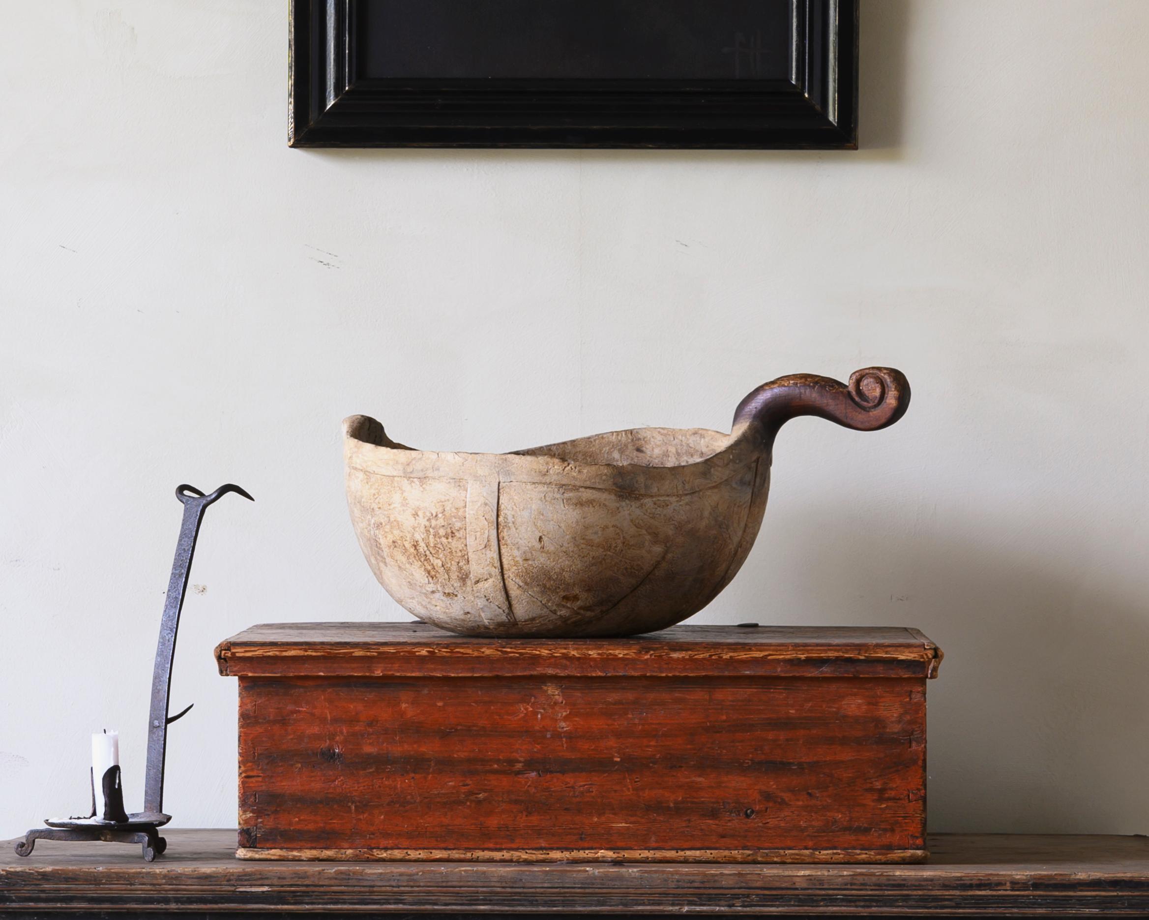 Exceptional early 18th century bowl / ale scoop with unusual figured handle, ca 1720 Sweden.