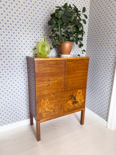 Exceptional Swedish Modern Intarsia Cabinet Depicting Artemis on Mount Olympus.