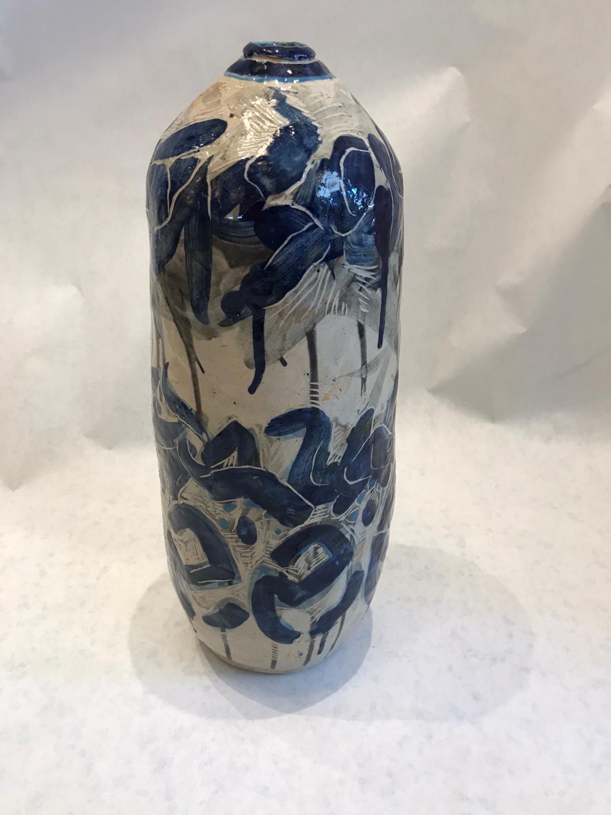 The beautiful abstract graphics vase in rich deep blues and grays. No marking but this vintage piece definitely has a look of Picasso!