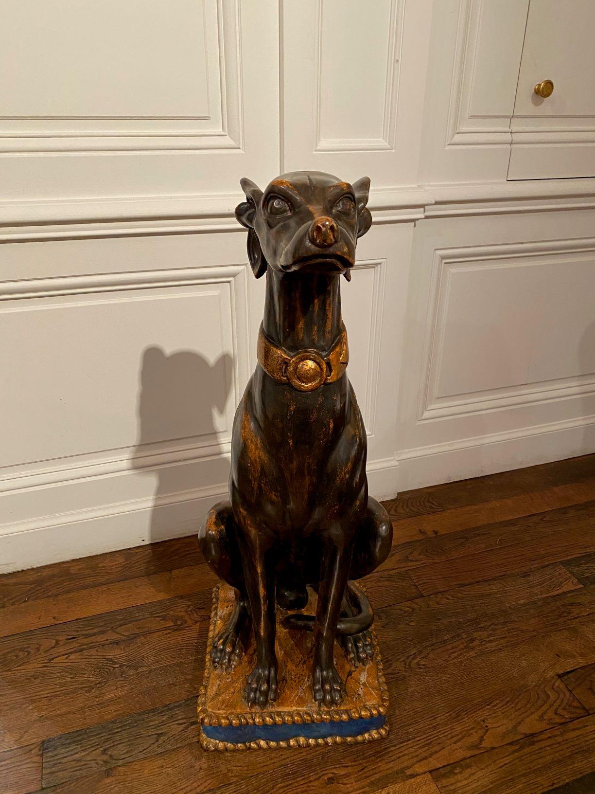 A tall Italian carved polychrome and gilt wood model of a greyhound seated on a cushion.

Italy, 19th century

Dimensions : H. 83 cm – W. 32 cm – D. 29 cm (32 5/8 – 12 9/16 x 11 7/16 in)

The greyhound sculpture from the 19th century features