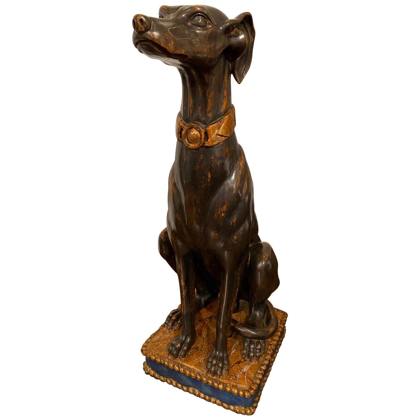 A tall Italian carved polychrome and giltwood model of a greyhound seated on a cushion.

Italy, 19th century

Dimensions : H. 83 cm – W. 32 cm – D. 29 cm (32 5/8 – 12 9/16 x 11 7/16 in)

The greyhound sculpture from the 19th century features