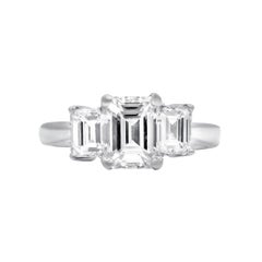 Exceptional Three stone emerald cut diamond ring 