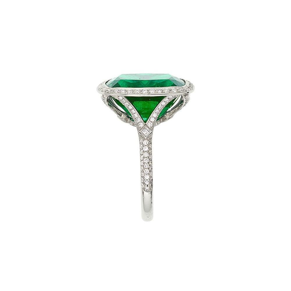 A simply amazing emerald ring by famed jewelers Tiffany & Co. The cushion-shaped gem emerald weighs 9.41 carats and has an intense vivid green color that rivals any other emerald you put in front of it. It is accented by 0.63 carats of fine round