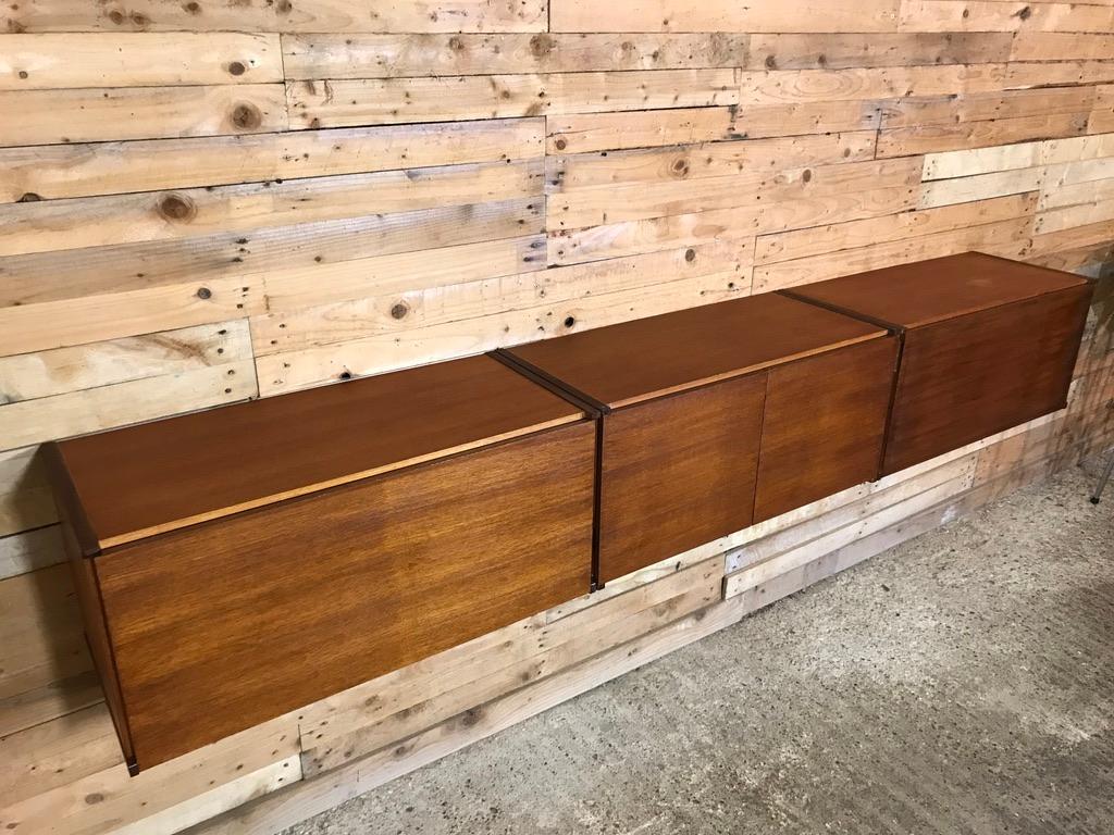 Sought after totally free-hanging extra large sideboard, slightly darker, super minimalistic. Height can be adjusted as required, it is very easy to fix to the wall (with metal or wooden wall brackets which are all included!). This set comes in