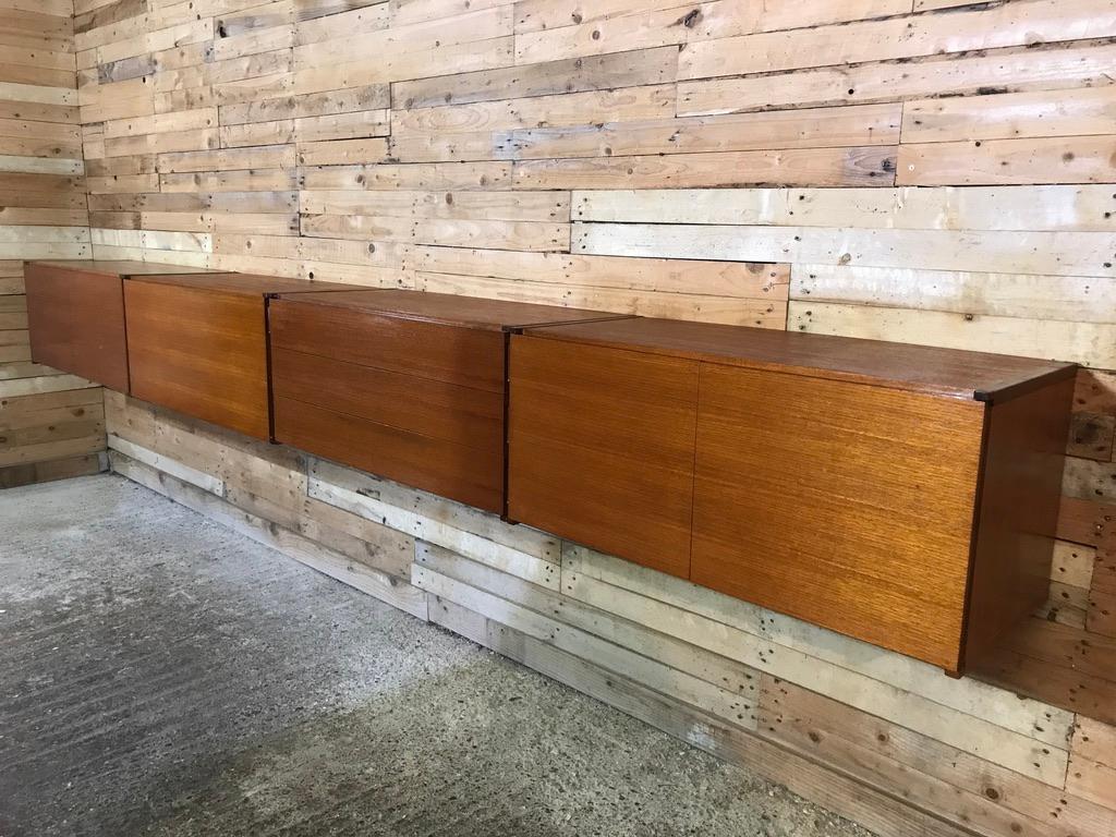 Sought after totally free-hanging extra large sideboard, super minimalistic. Height can be adjusted as required, it is very easy to fix to the wall (with metal or wooden wall brackets which are all included!). This set comes in four parts, each