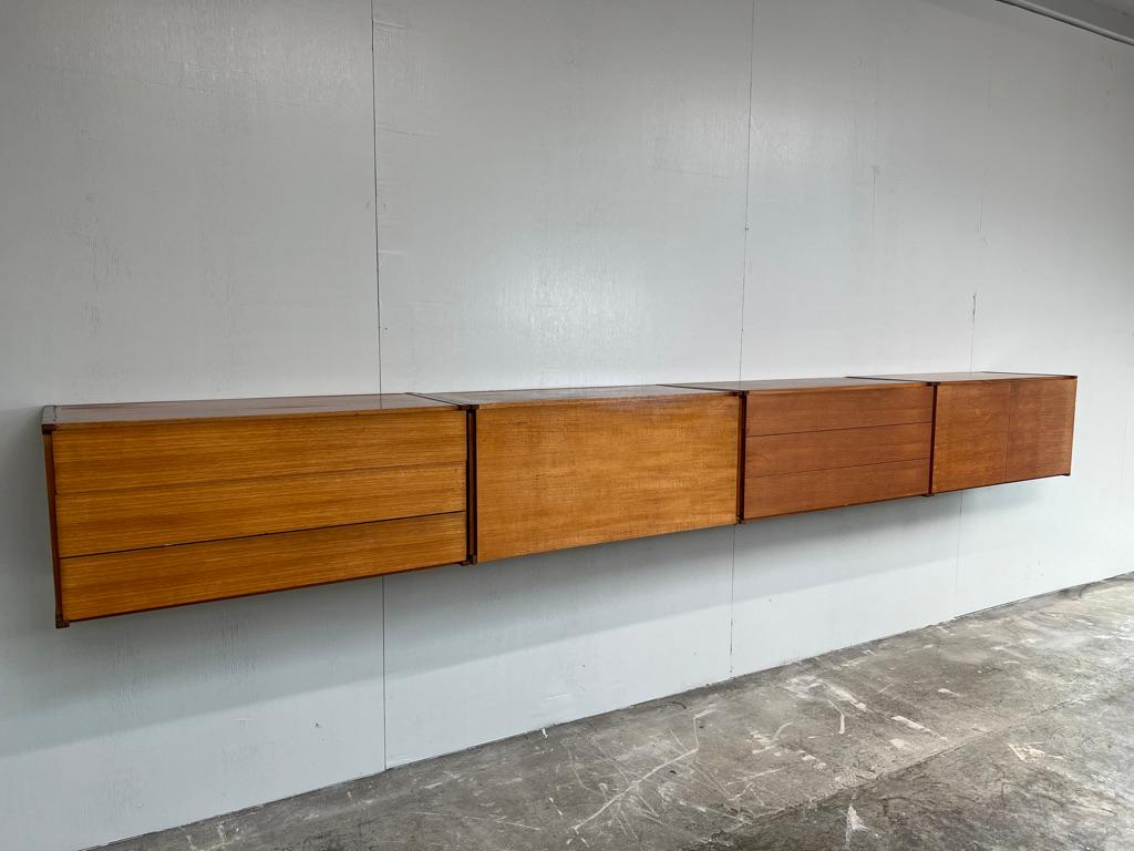 Sought after totally free-hanging extra large sideboard, super minimalistic. Height can be adjusted as required, it is very easy to fix to the wall (with metal or wooden wall brackets which are all included!). This set comes in four parts, each