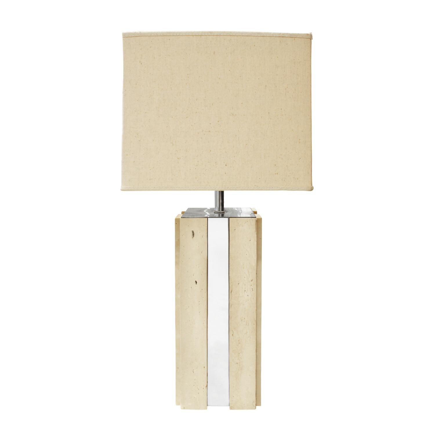 Exceptional large table lamp in travertine with vertical chrome accents, Italian 1960s. This lamp is a beautiful combination of materials. 

Measures: Shade W: 16 inches
Shade D: 16 incehes
Shade H: 11.5 inches.