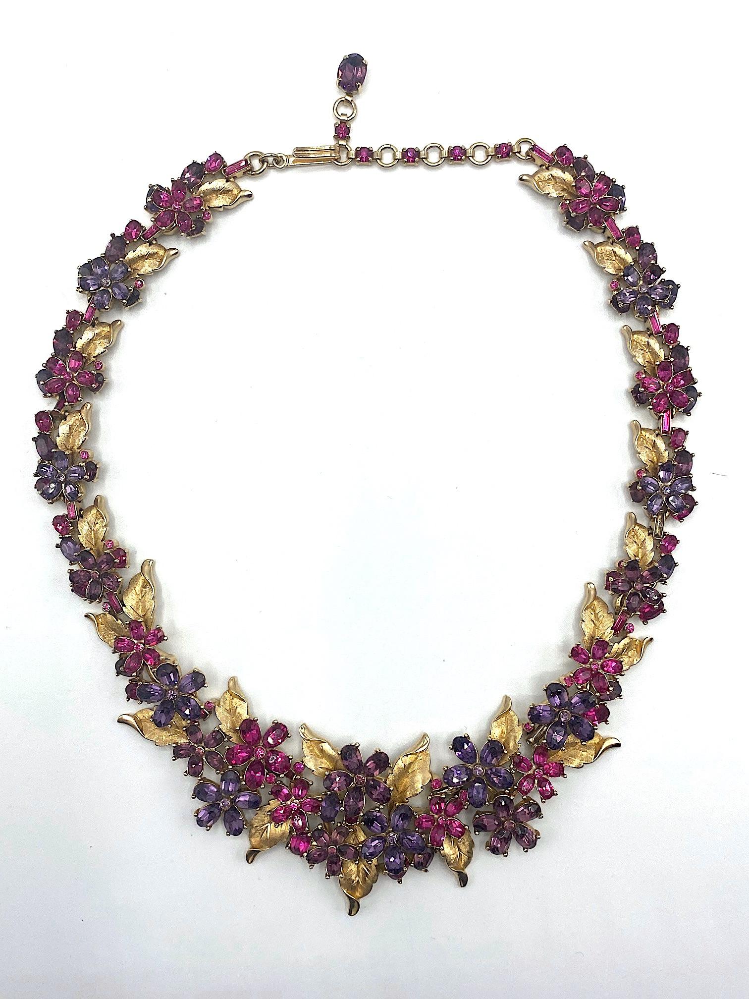 An absolutely spectacular and well loved 1950s floral rhinestone parure by American fashion jewelry company Trifari. The parure consists of necklace, bracelet, earrings and brooch. All in extremely fine condition and look barely worn. There are